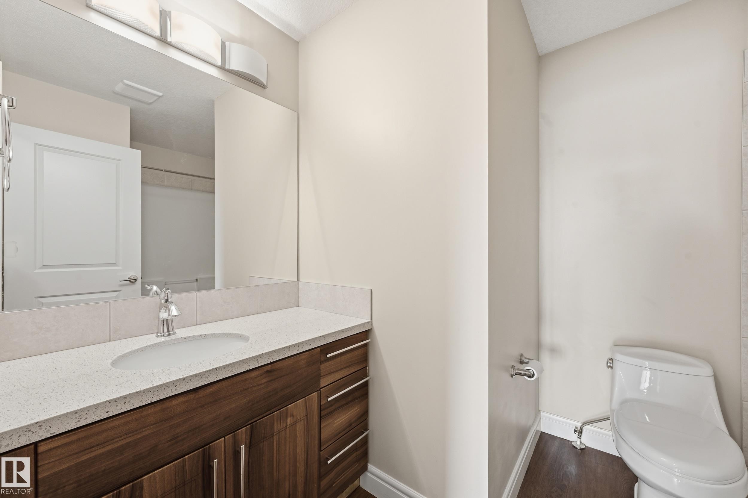 Bathroom with vanity and dark wood-style floors - 1351 Cunningham Drive, Edmonton, AB - Indoor Photo Showing Bathroom