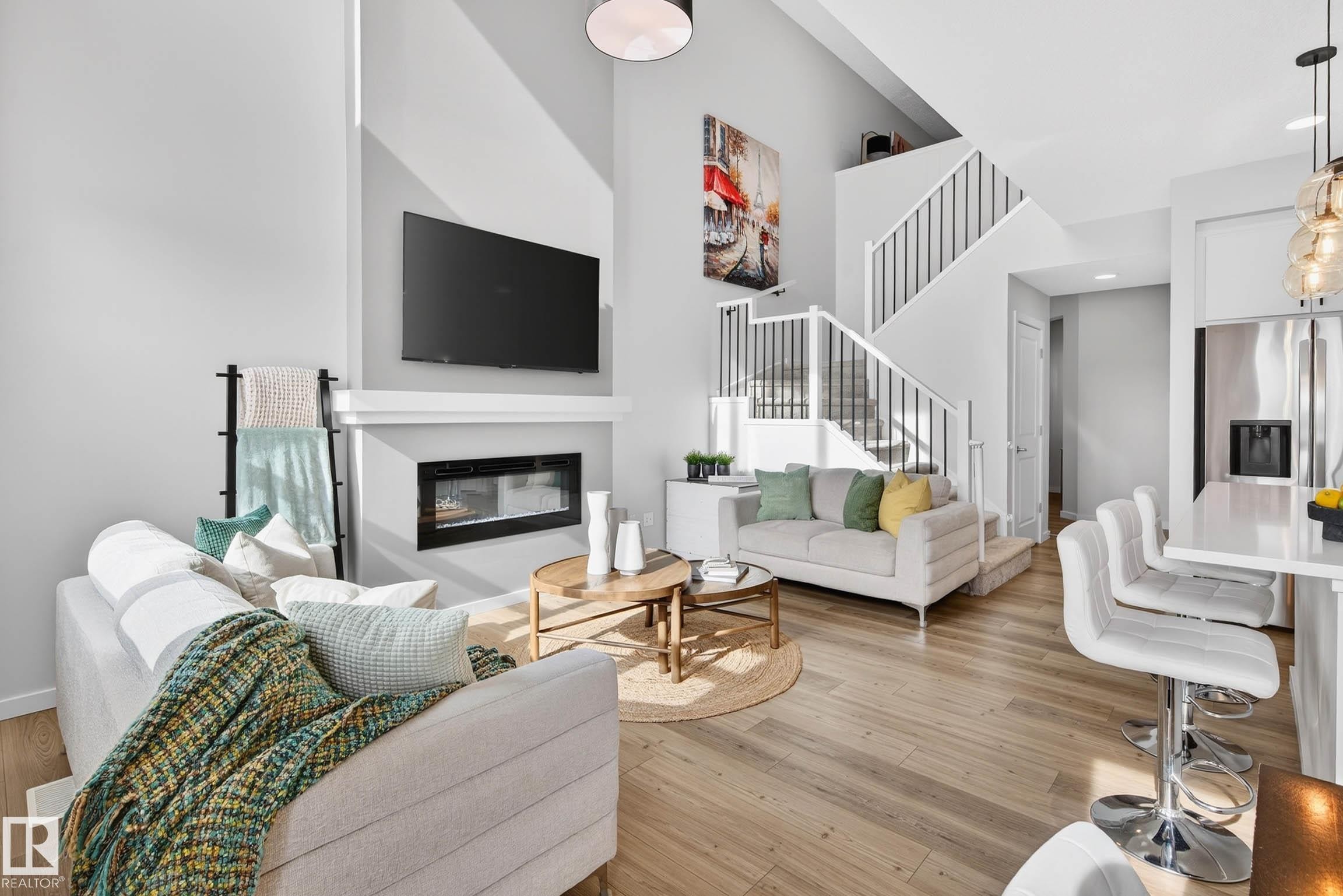 324 Stiles Way, Leduc, AB - Indoor Photo Showing Living Room With Fireplace