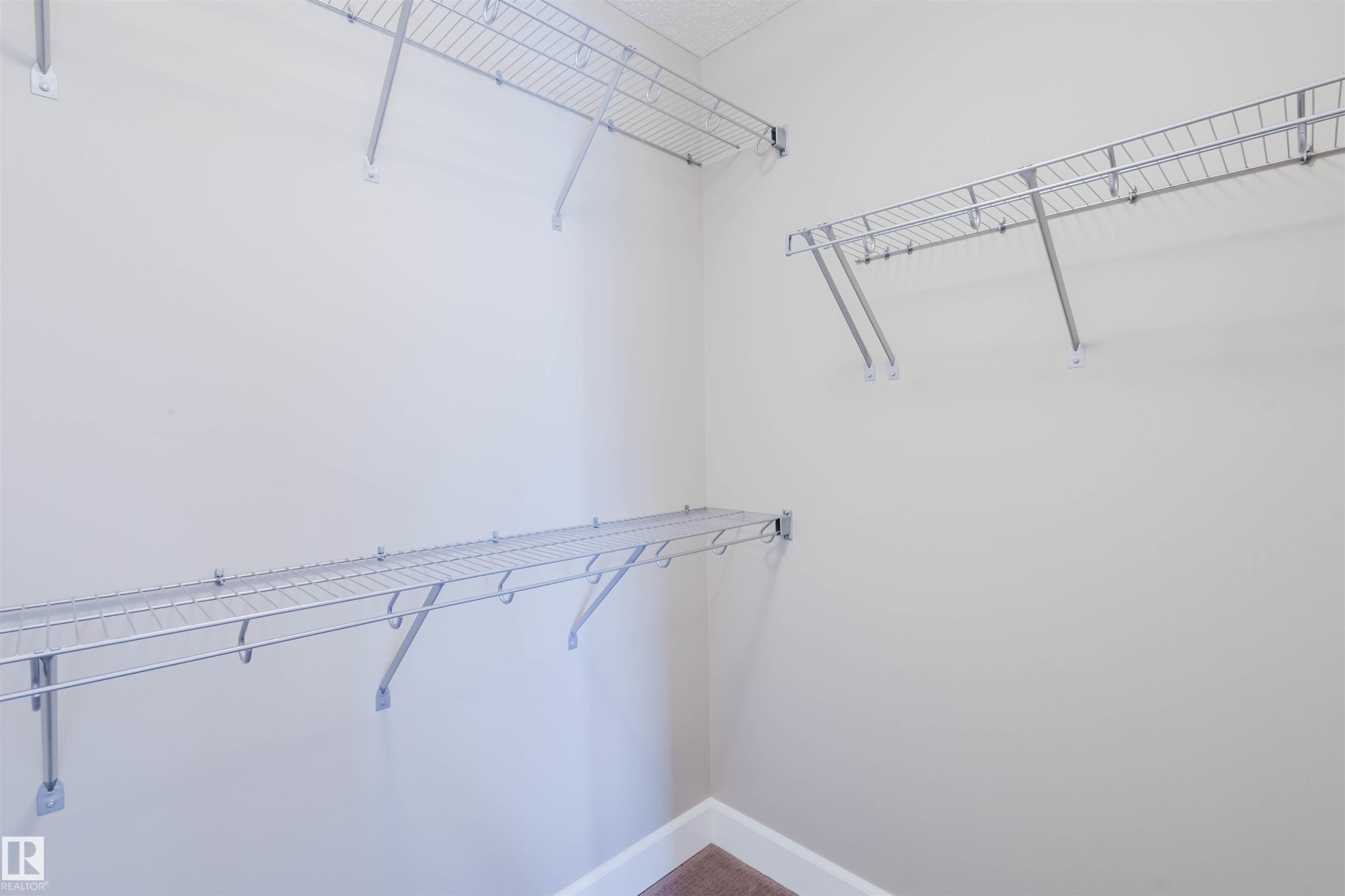 View of walk in closet - 1957 Ainslie Link, Edmonton, AB - Indoor With Storage