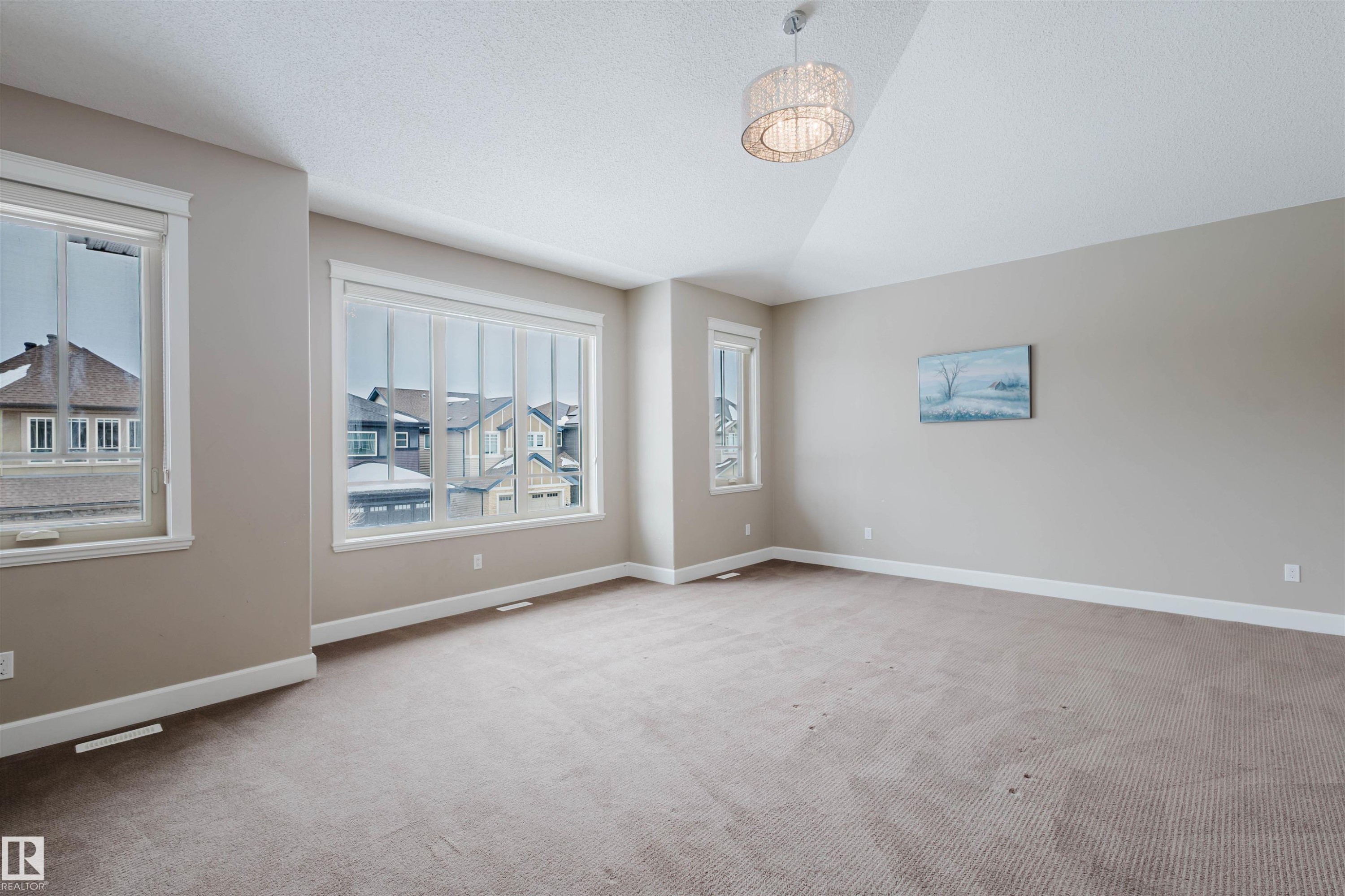 Unfurnished room with baseboards and light colored carpet - 1957 Ainslie Link, Edmonton, AB - Indoor Photo Showing Other Room