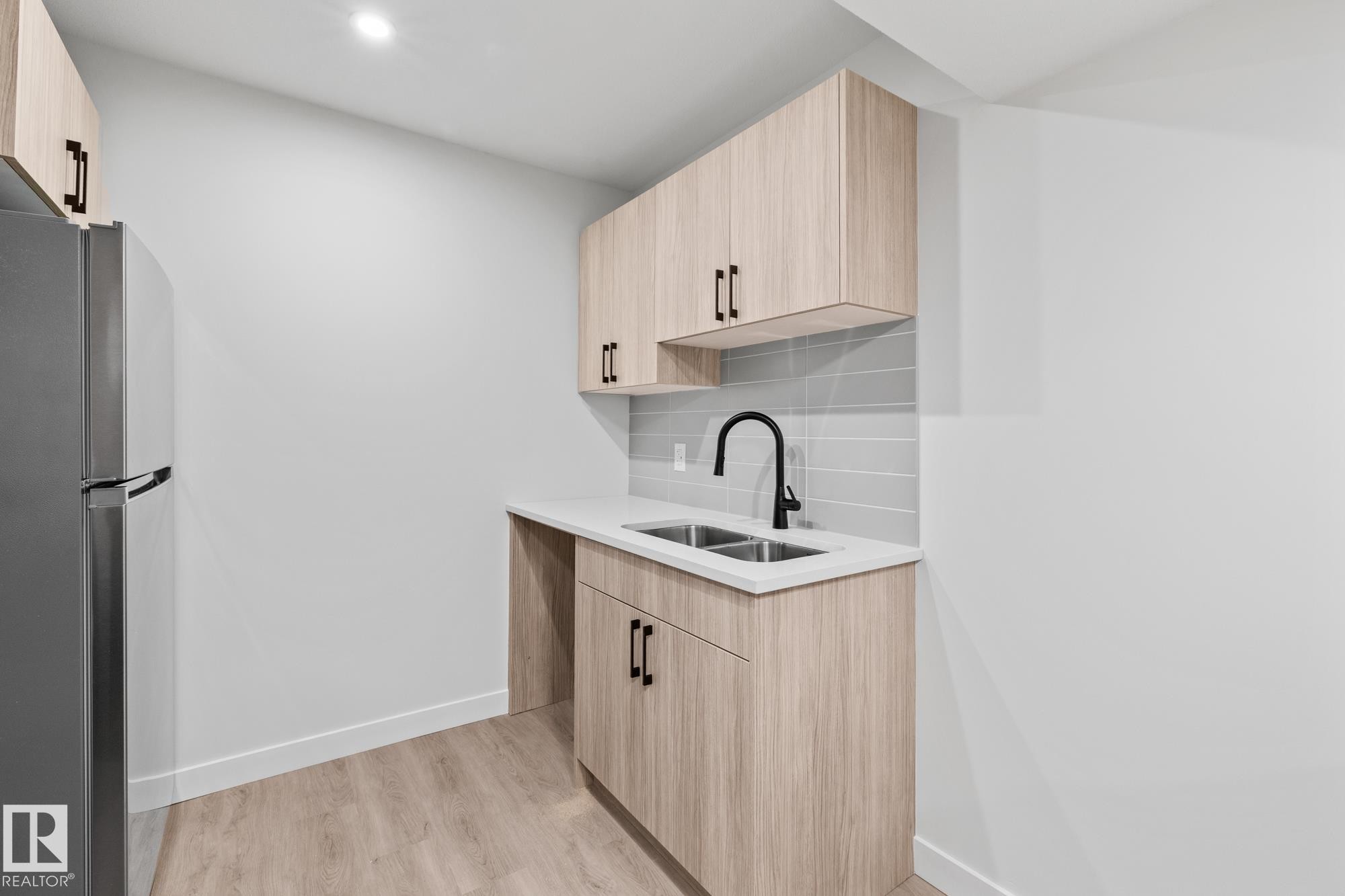 144 Honeysuckle Green, Leduc, AB - Indoor Photo Showing Kitchen With Double Sink