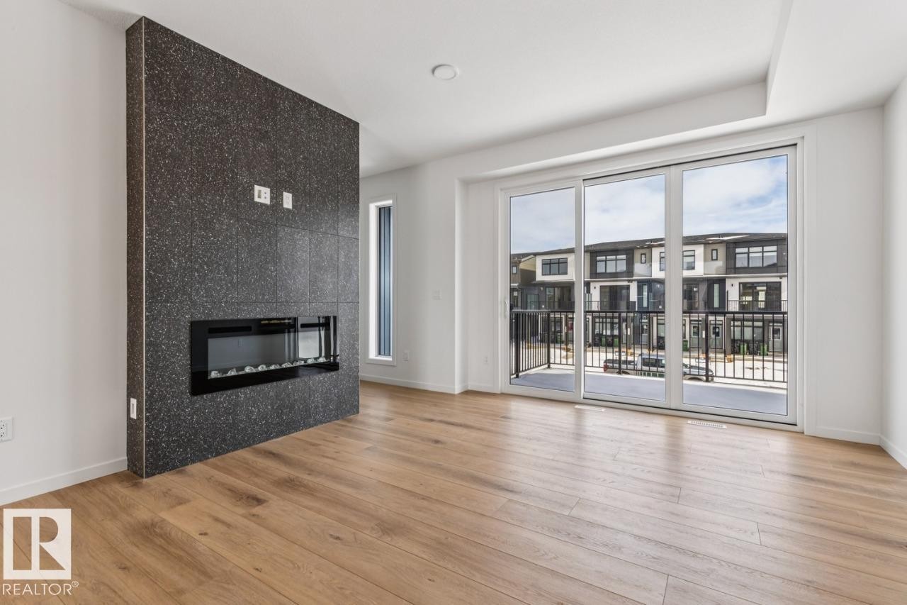 2618 Alces Way, Edmonton, AB - Indoor Photo Showing Living Room With Fireplace