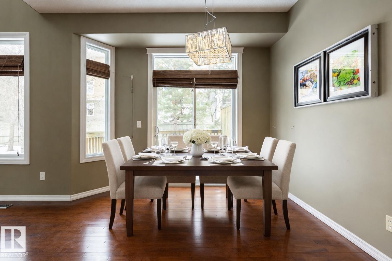 Dining room with dark wood-type flooring and hanging lights - 11622 11 Avenue, Edmonton, AB - Indoor Photo Showing Dining Room