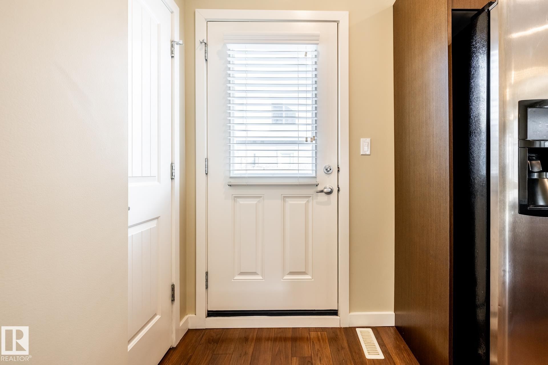 Entryway featuring wood finished floors and baseboards - 21 655 Watt Boulevard, Edmonton, AB - Indoor Photo Showing Other Room