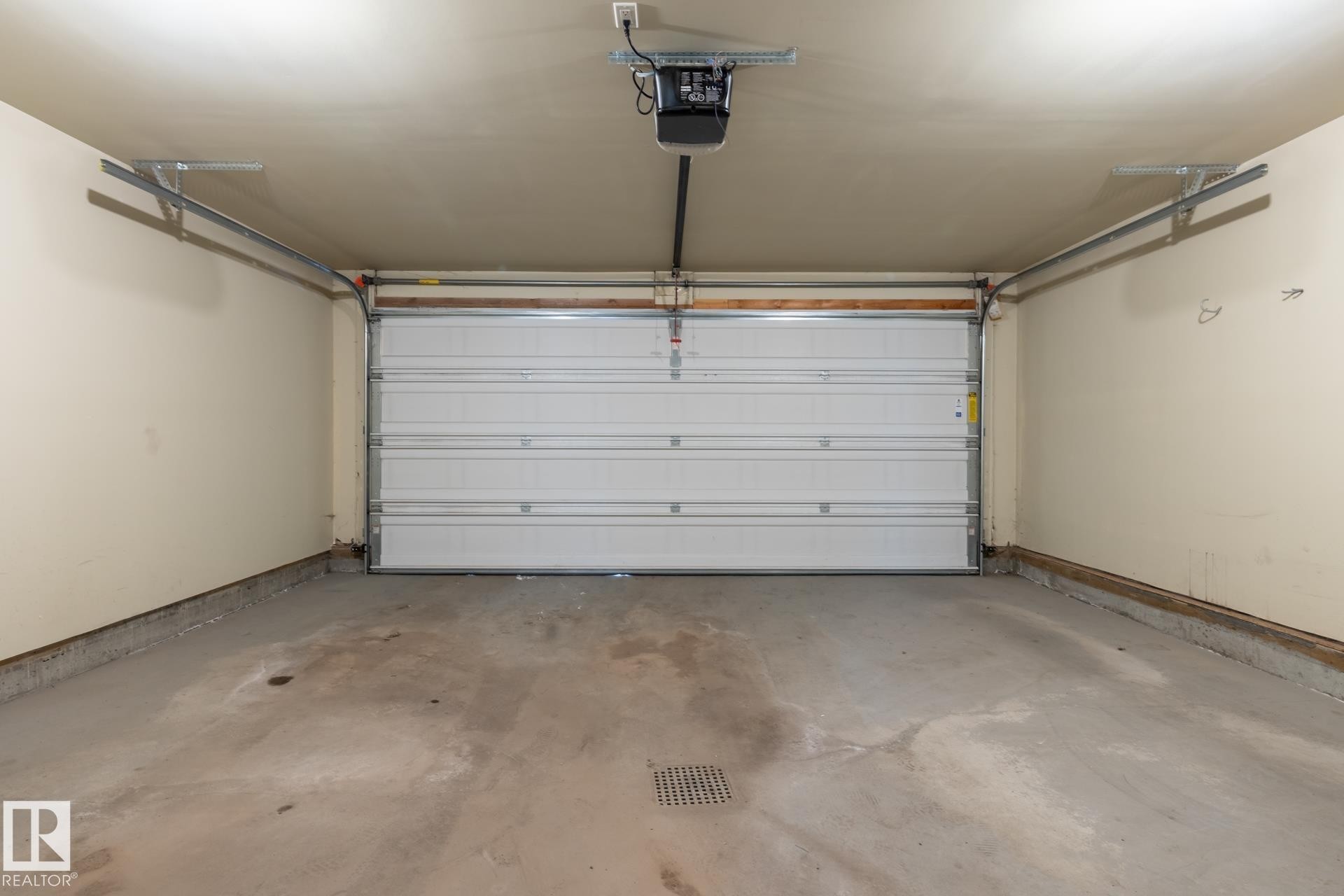 Garage featuring a garage door opener - 21 655 Watt Boulevard, Edmonton, AB - Indoor Photo Showing Garage