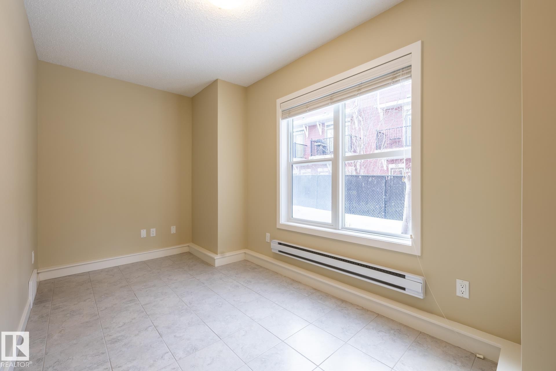 Spare room with a baseboard radiator and baseboards - 21 655 Watt Boulevard, Edmonton, AB - Indoor Photo Showing Other Room