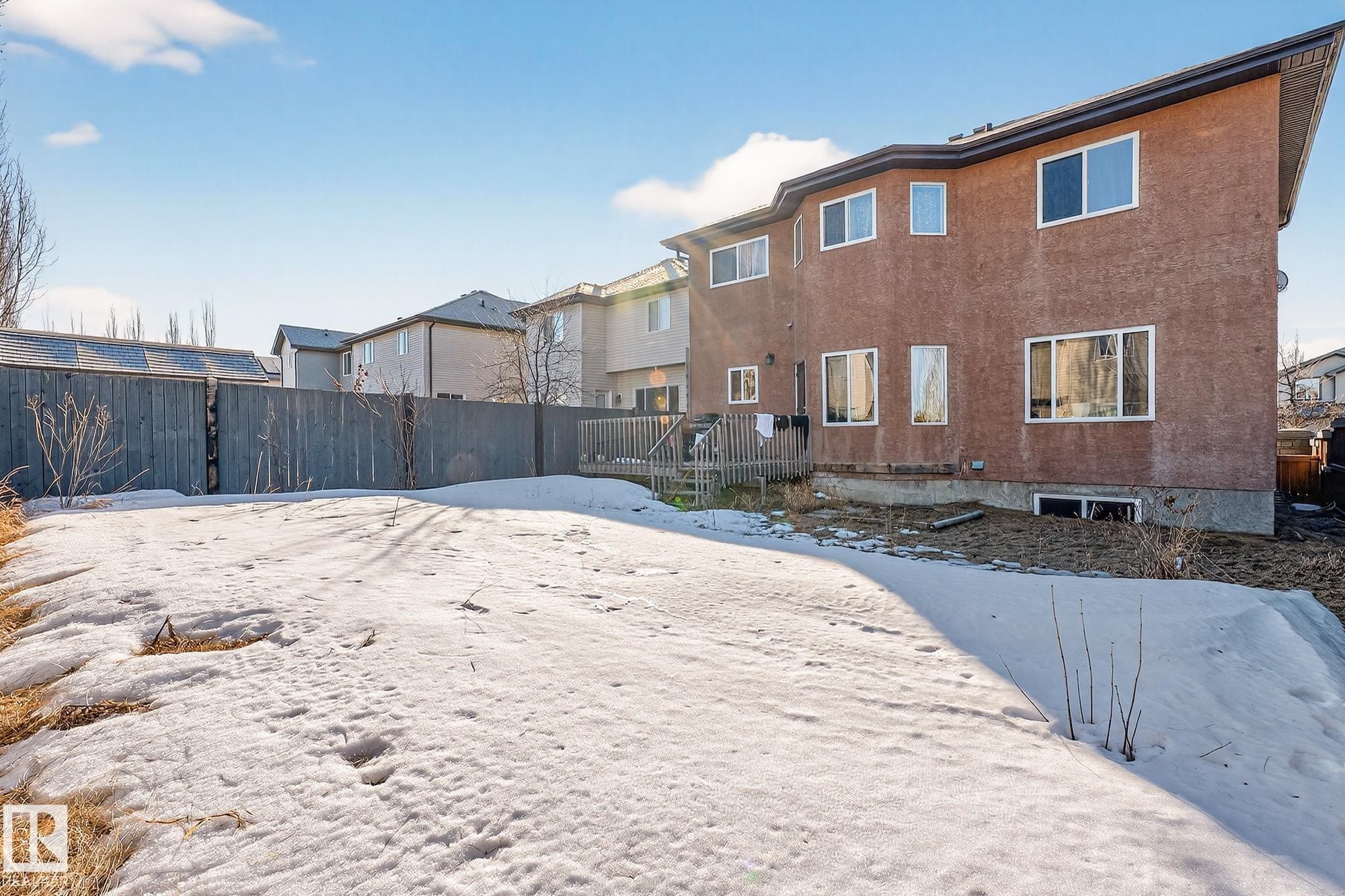 Snow covered house featuring stucco siding - 1660 Malone Way, Edmonton, AB - Outdoor