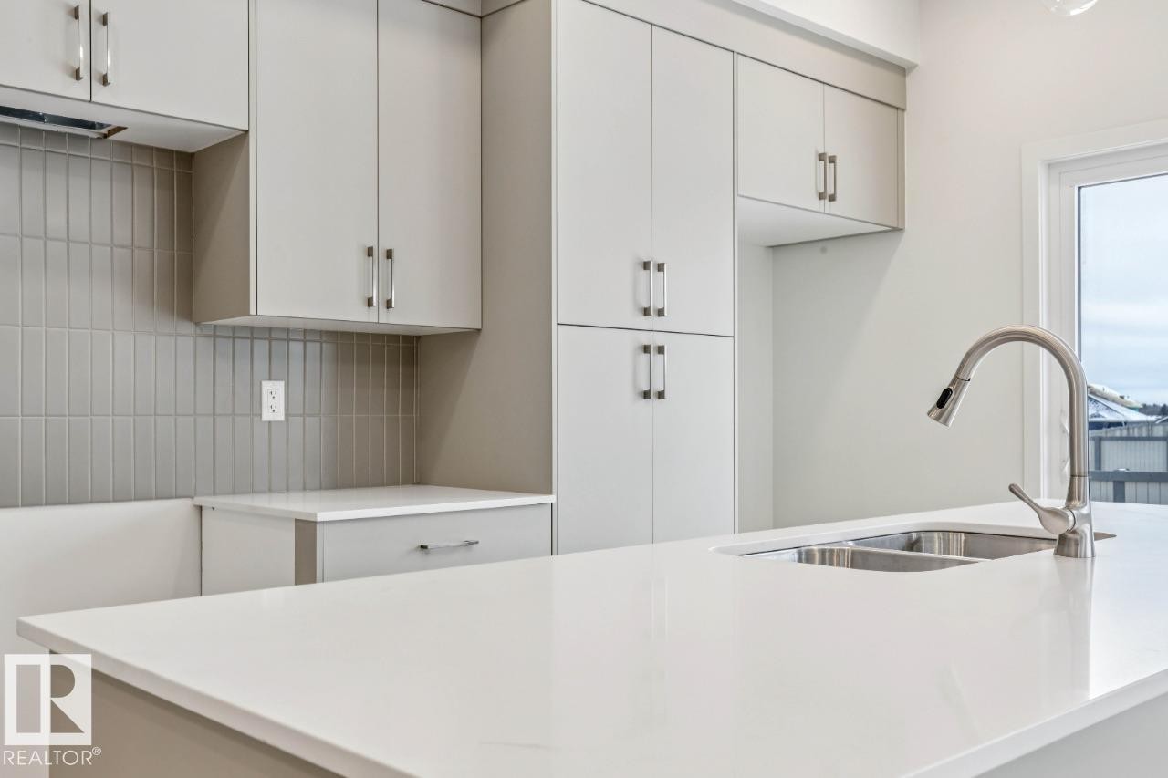 25 Stetson Loop, Ardrossan, AB - Indoor Photo Showing Kitchen With Double Sink