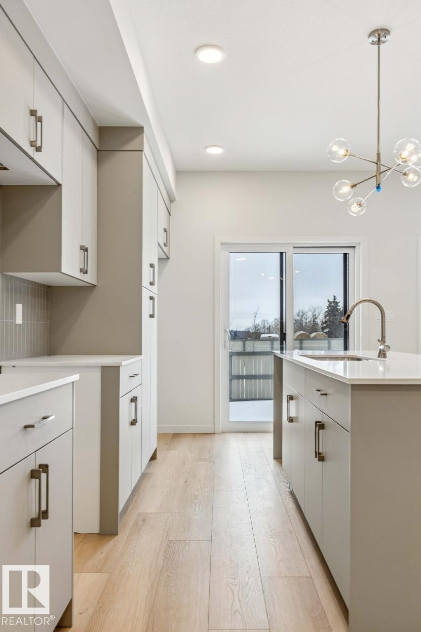 25 Stetson Loop, Ardrossan, AB - Indoor Photo Showing Kitchen With Double Sink