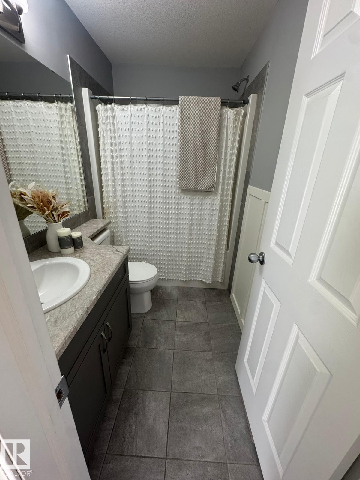 Bathroom with vanity and a textured ceiling - 17703 65 Street, Edmonton, AB - Indoor Photo Showing Bathroom