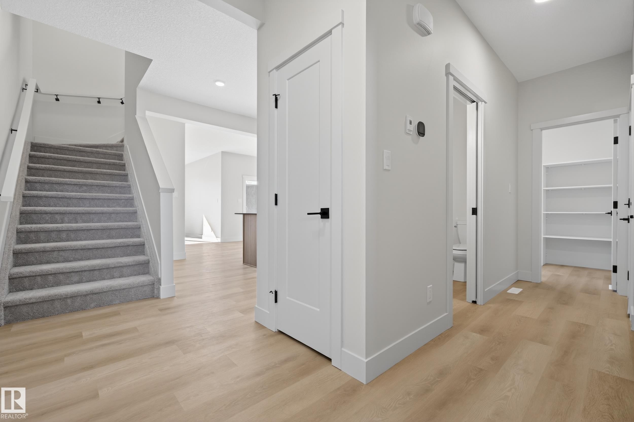 Hall with light wood-style floors and recessed lighting - 22 Grayson Green, Stony Plain, AB - Indoor Photo Showing Other Room
