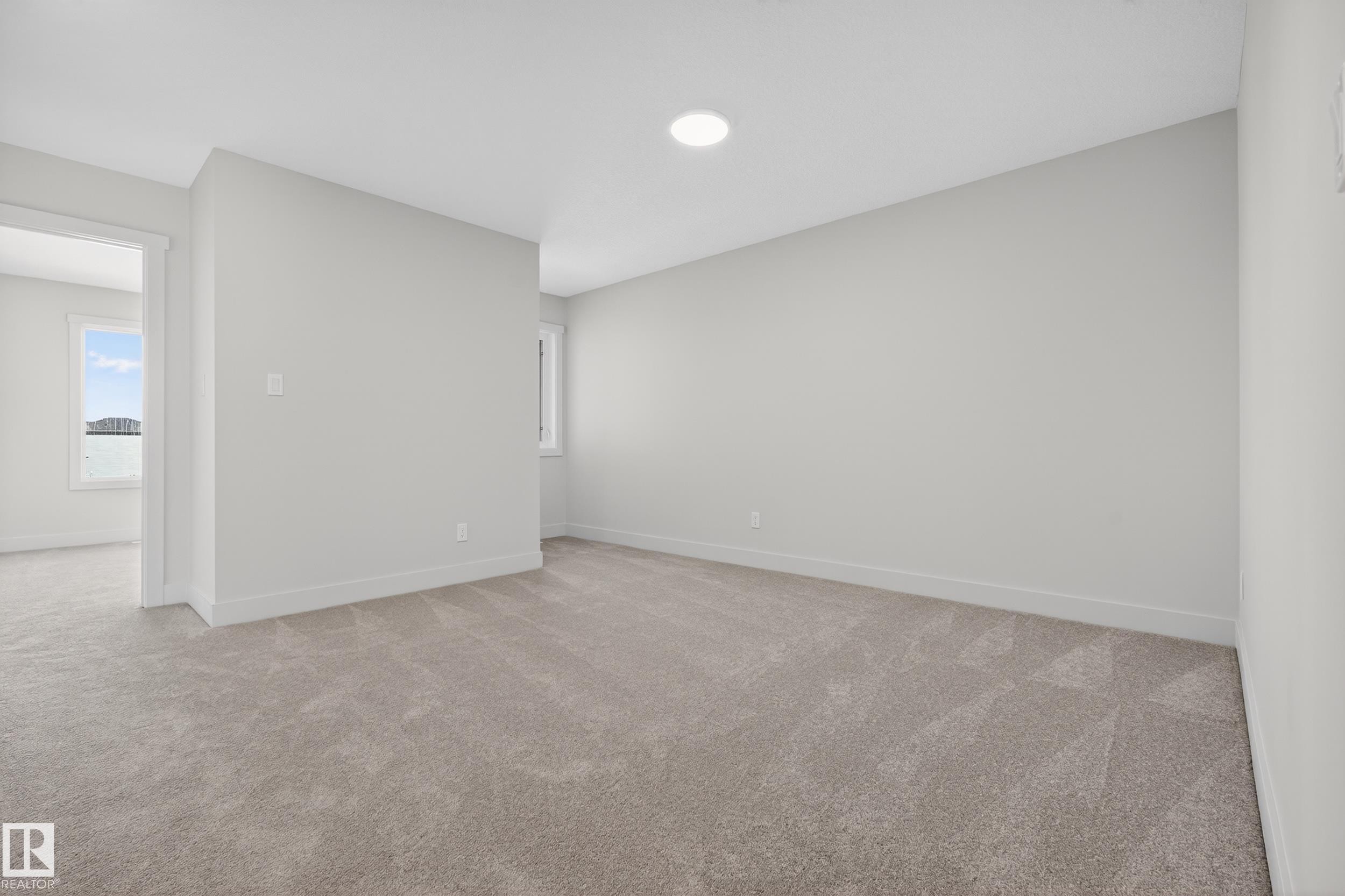 Unfurnished room with light carpet - 22 Grayson Green, Stony Plain, AB - Indoor Photo Showing Other Room
