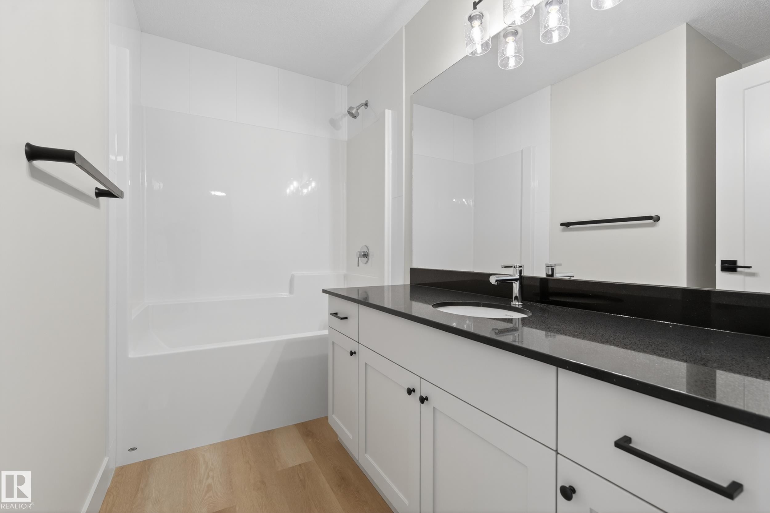 Bathroom with vanity, light wood-type flooring, and shower / bath combination - 22 Grayson Green, Stony Plain, AB - Indoor Photo Showing Bathroom