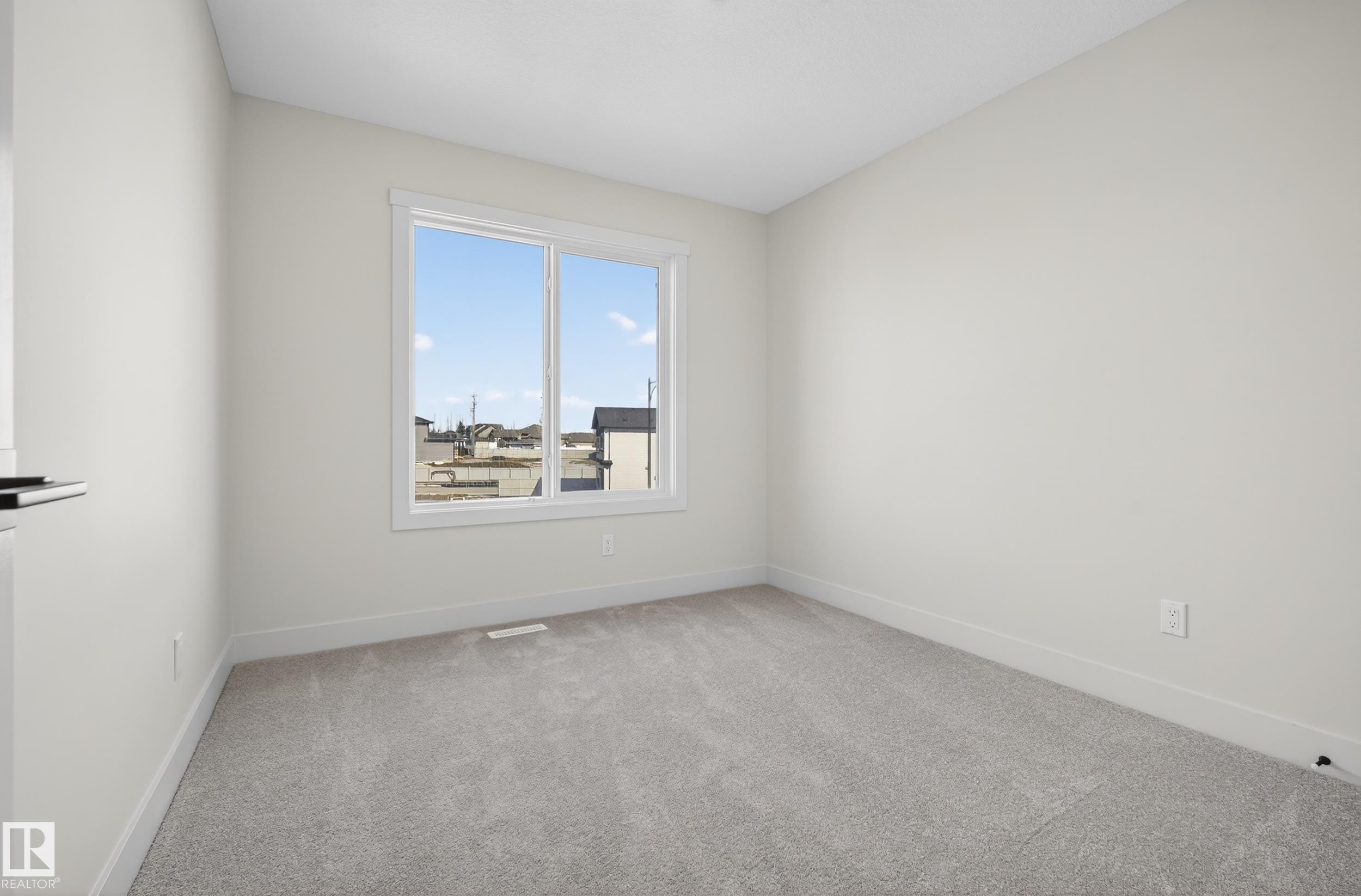 Unfurnished room featuring light colored carpet and baseboards - 22 Grayson Green, Stony Plain, AB - Indoor Photo Showing Other Room