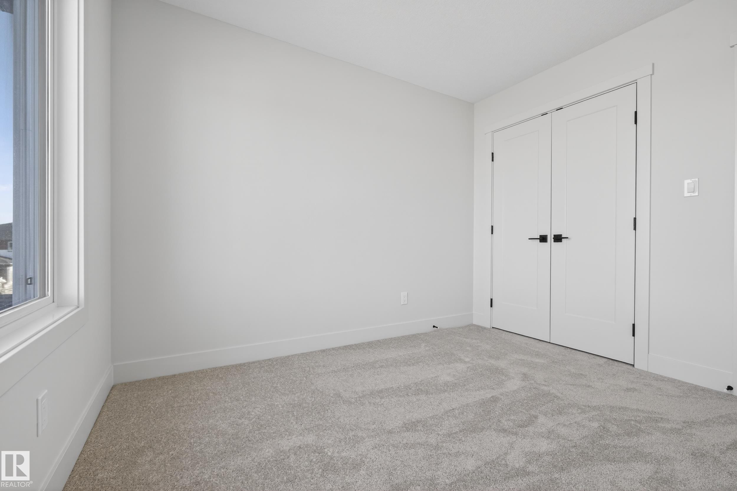 Unfurnished bedroom with carpet flooring and a closet - 22 Grayson Green, Stony Plain, AB - Indoor Photo Showing Other Room