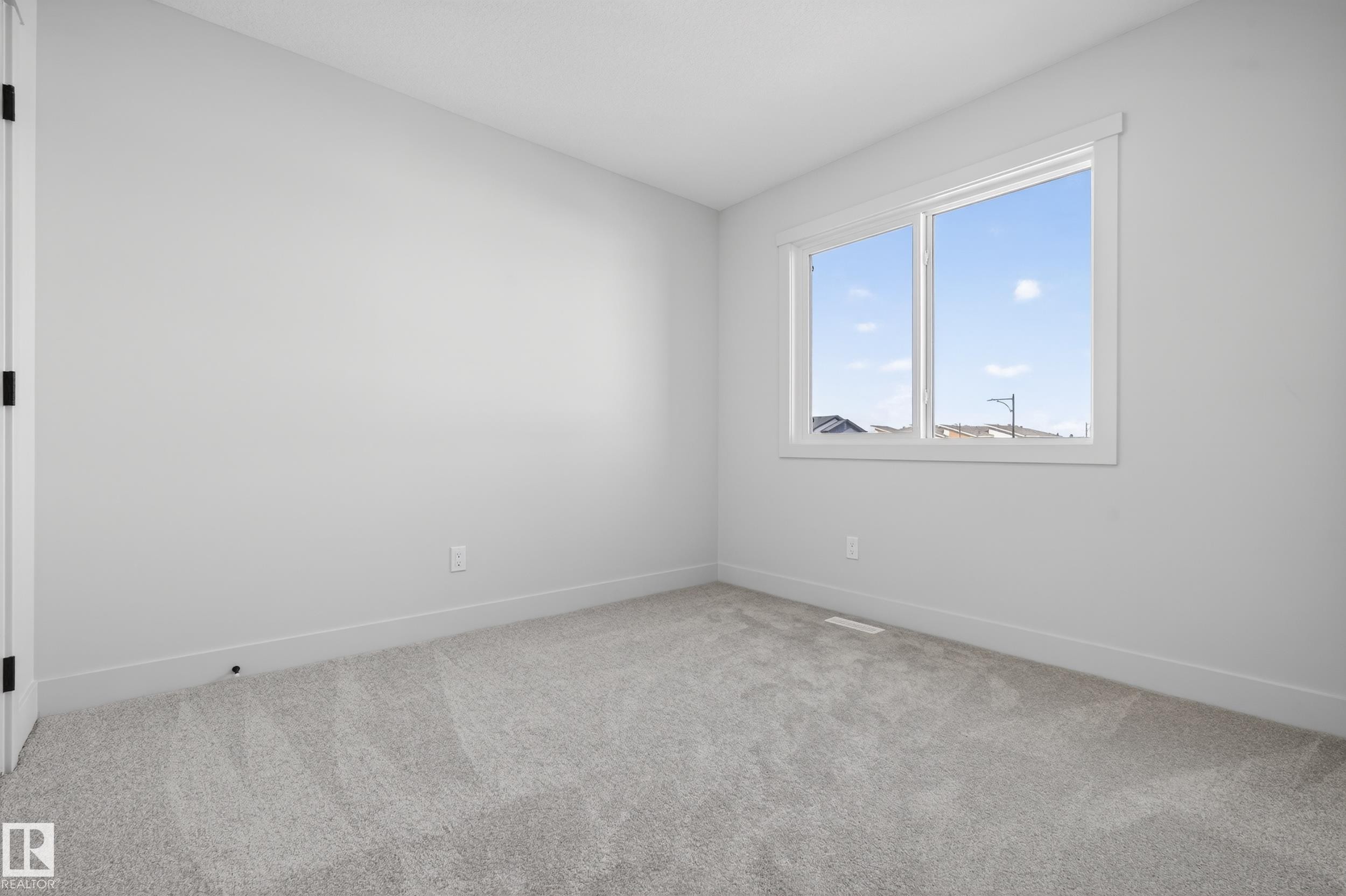 Empty room featuring carpet - 22 Grayson Green, Stony Plain, AB - Indoor Photo Showing Other Room
