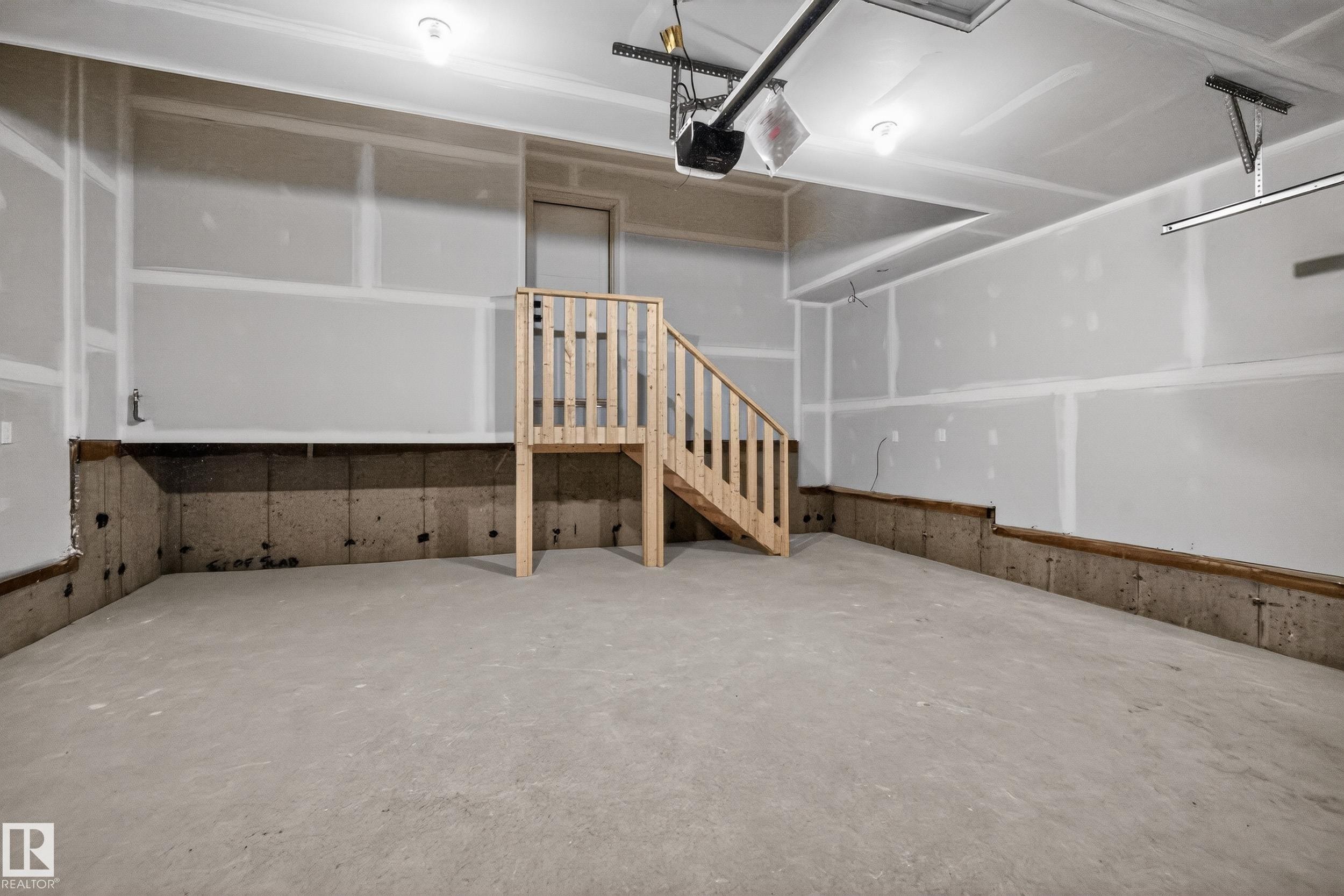 Garage with a garage door opener - 22 Grayson Green, Stony Plain, AB - Indoor Photo Showing Garage