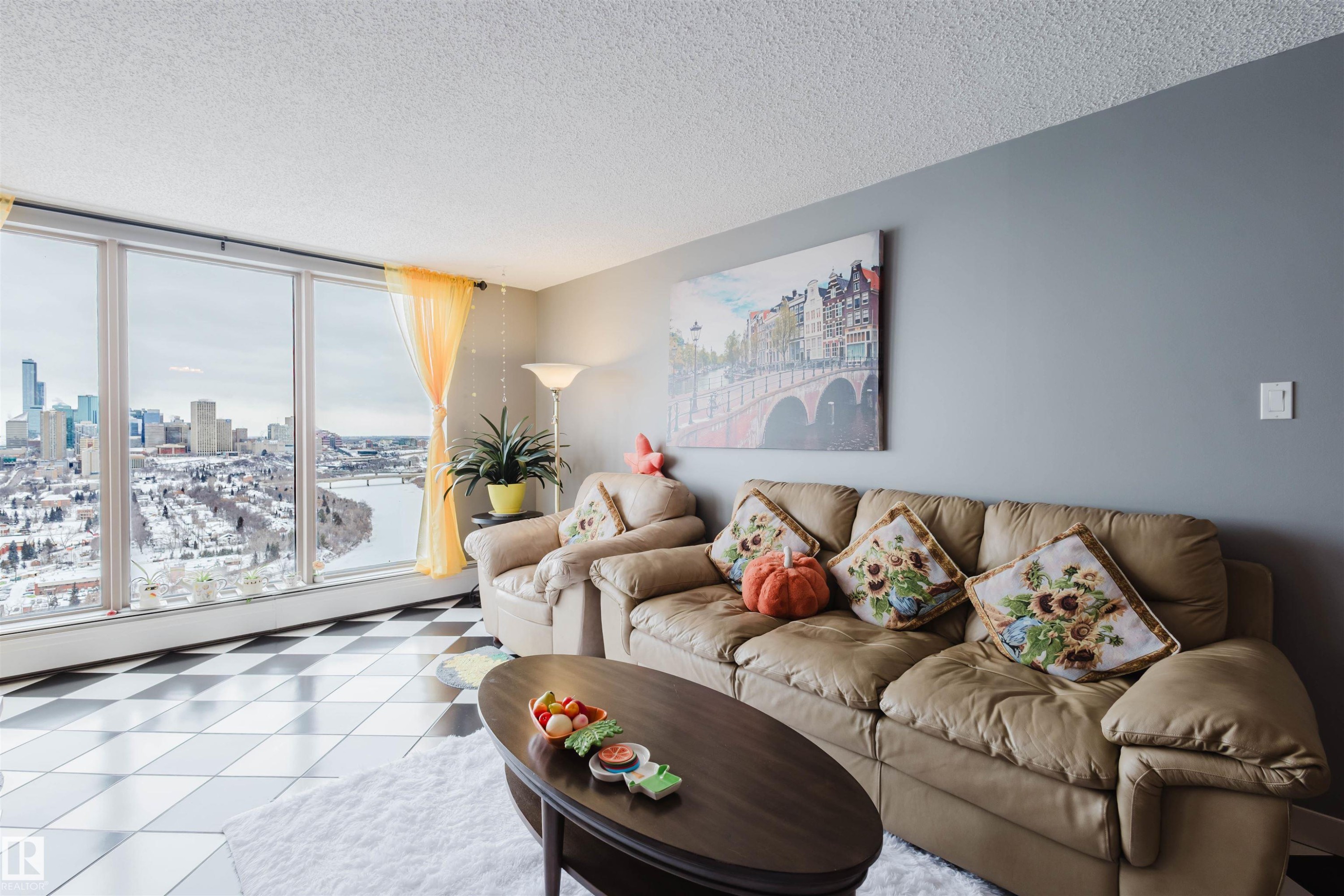 Living room with a textured ceiling and a view of city - 1803 10149 Saskatchewan Drive, Edmonton, AB - Indoor Photo Showing Living Room
