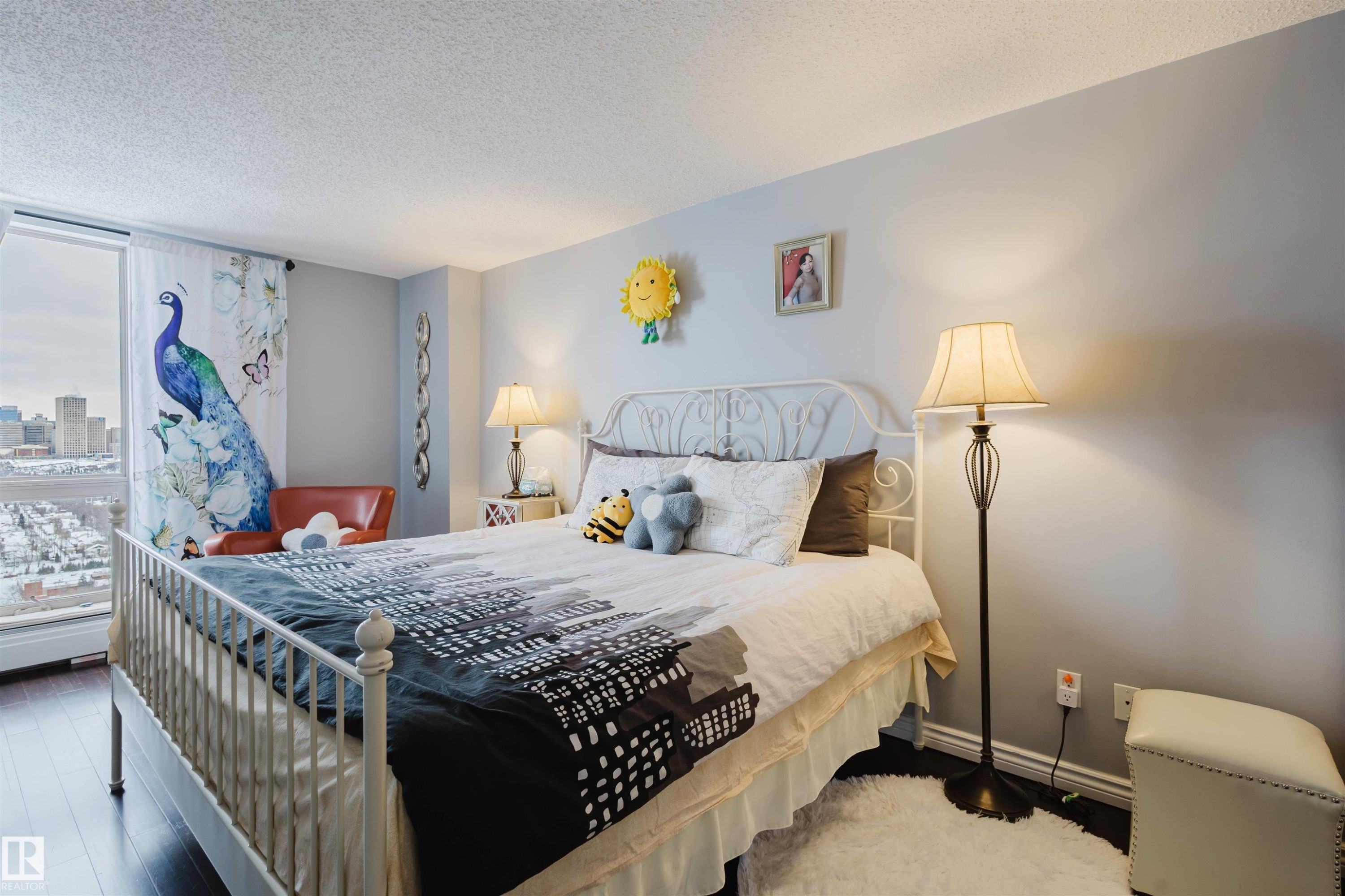 Bedroom featuring a textured ceiling and wood finished floors - 1803 10149 Saskatchewan Drive, Edmonton, AB - Indoor Photo Showing Bedroom