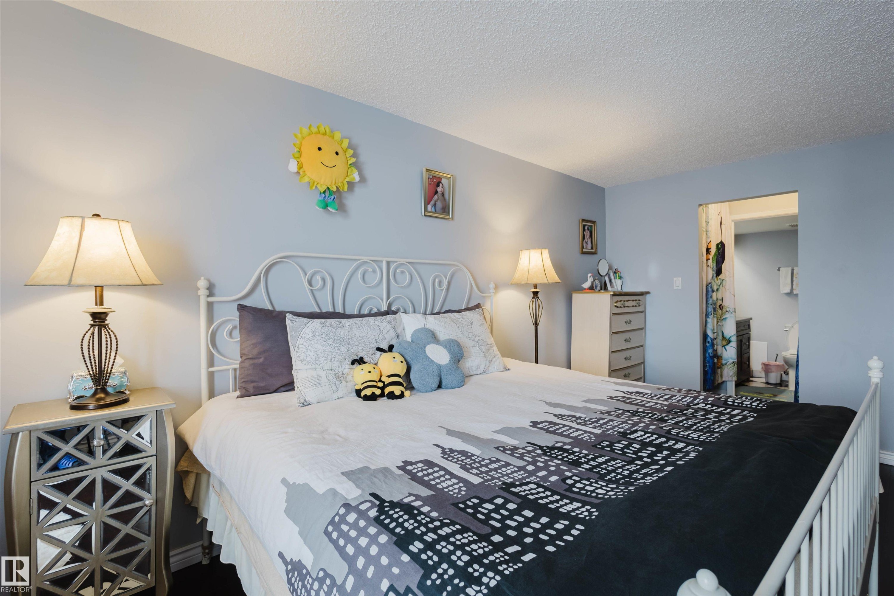 Bedroom featuring a textured ceiling and a spacious closet - 1803 10149 Saskatchewan Drive, Edmonton, AB - Indoor Photo Showing Bedroom