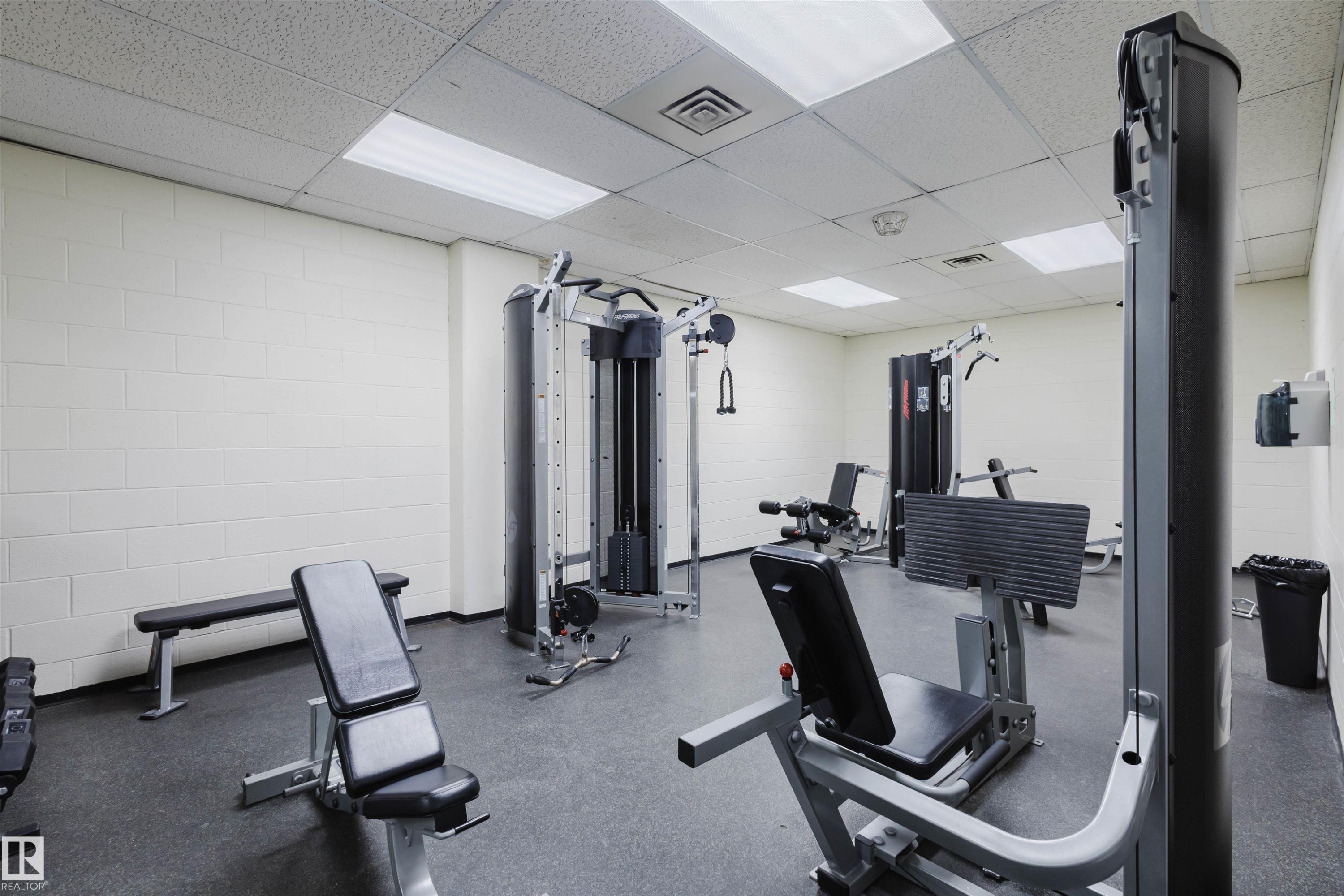 Workout area with a paneled ceiling - 1803 10149 Saskatchewan Drive, Edmonton, AB - Indoor Photo Showing Gym Room