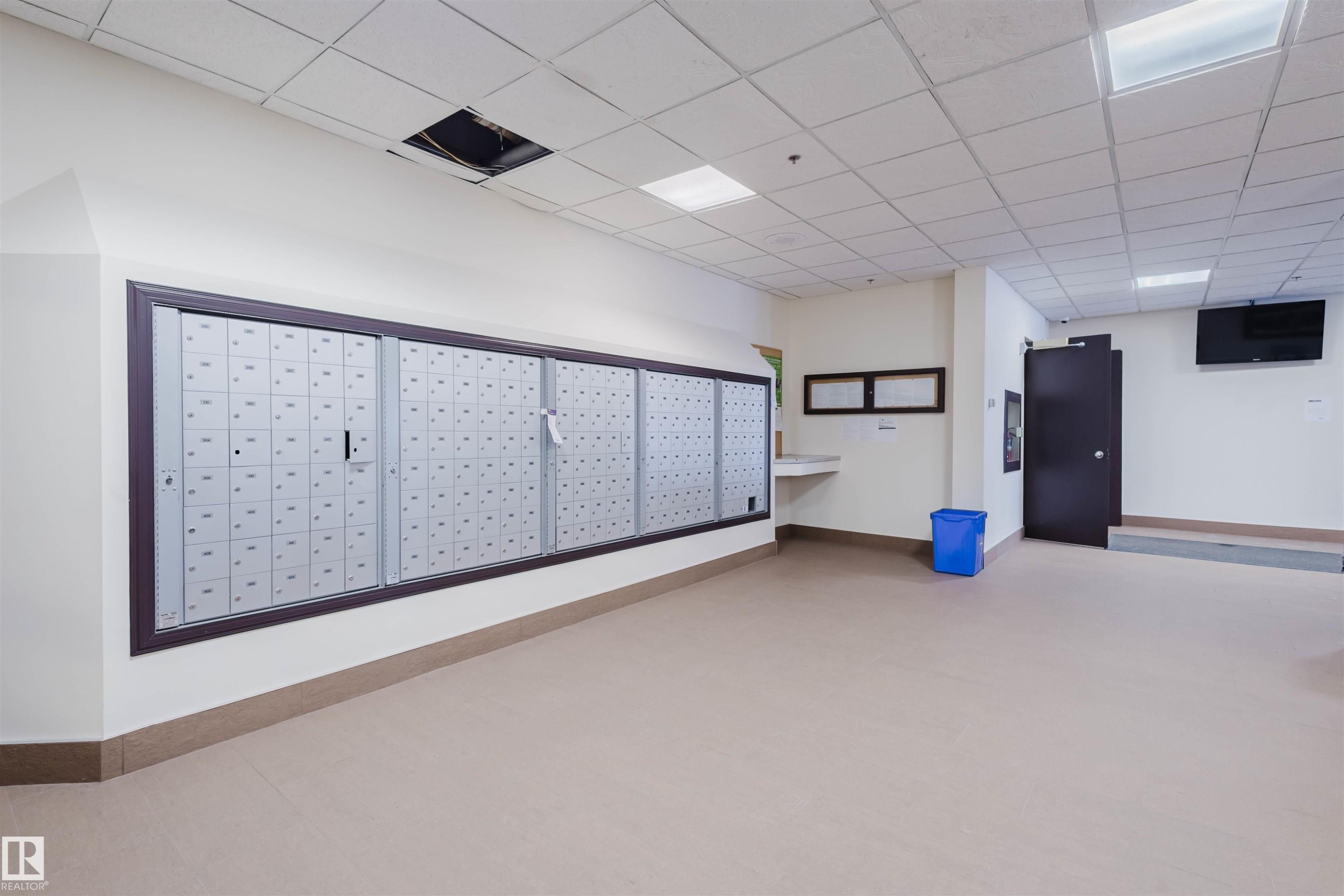 View of home's community with mail area and a drop ceiling - 1803 10149 Saskatchewan Drive, Edmonton, AB - Indoor Photo Showing Other Room