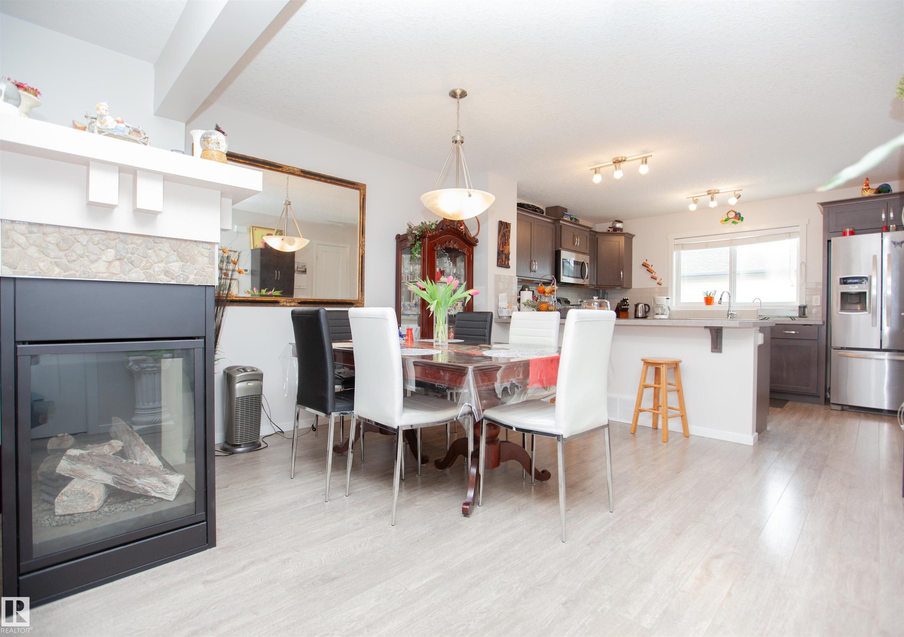2902 Maple Way, Edmonton, AB - Indoor Photo Showing Dining Room With Fireplace