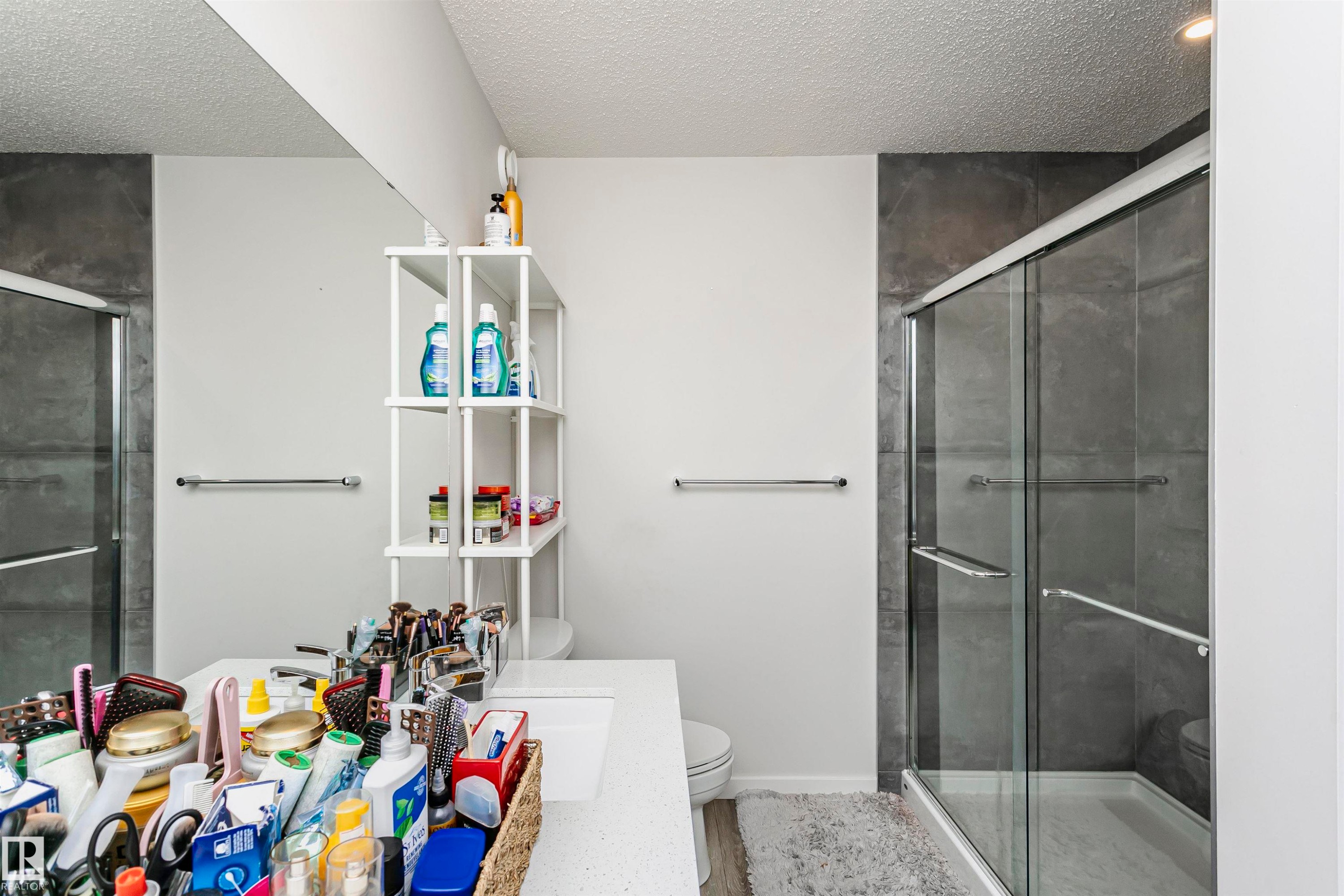 Bathroom with vanity, a shower stall, and a textured ceiling - 9421 Pear Crescent, Edmonton, AB - Indoor Photo Showing Bathroom
