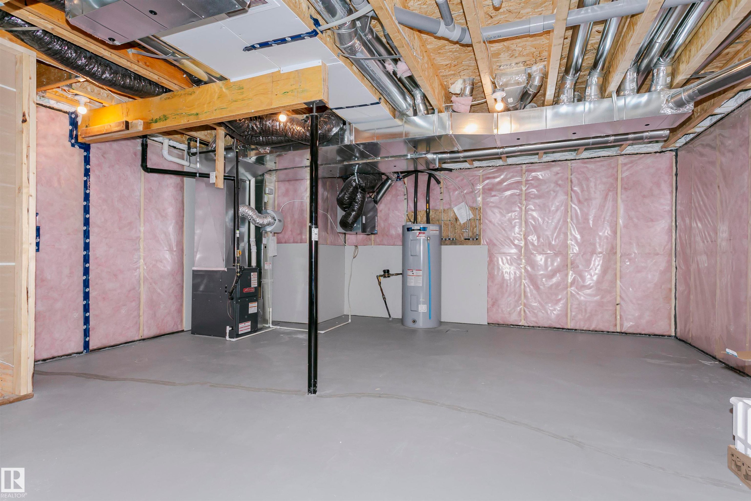 Unfinished basement with heating unit and water heater - 9421 Pear Crescent, Edmonton, AB - Indoor Photo Showing Basement