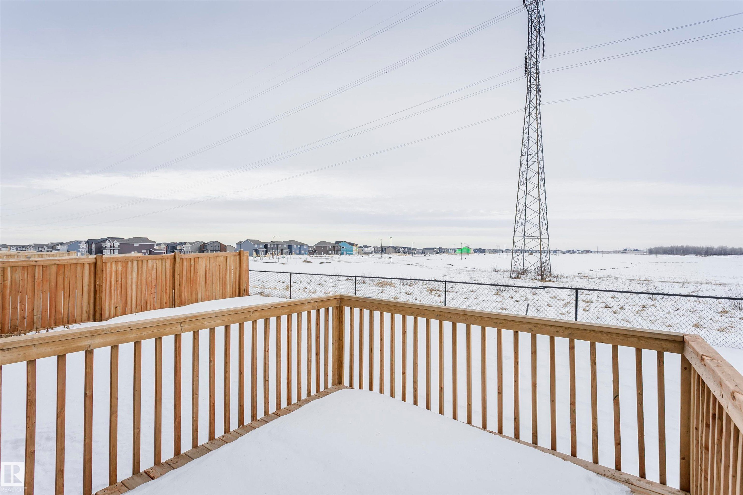 Snow covered deck with a residential view - 9421 Pear Crescent, Edmonton, AB - Outdoor