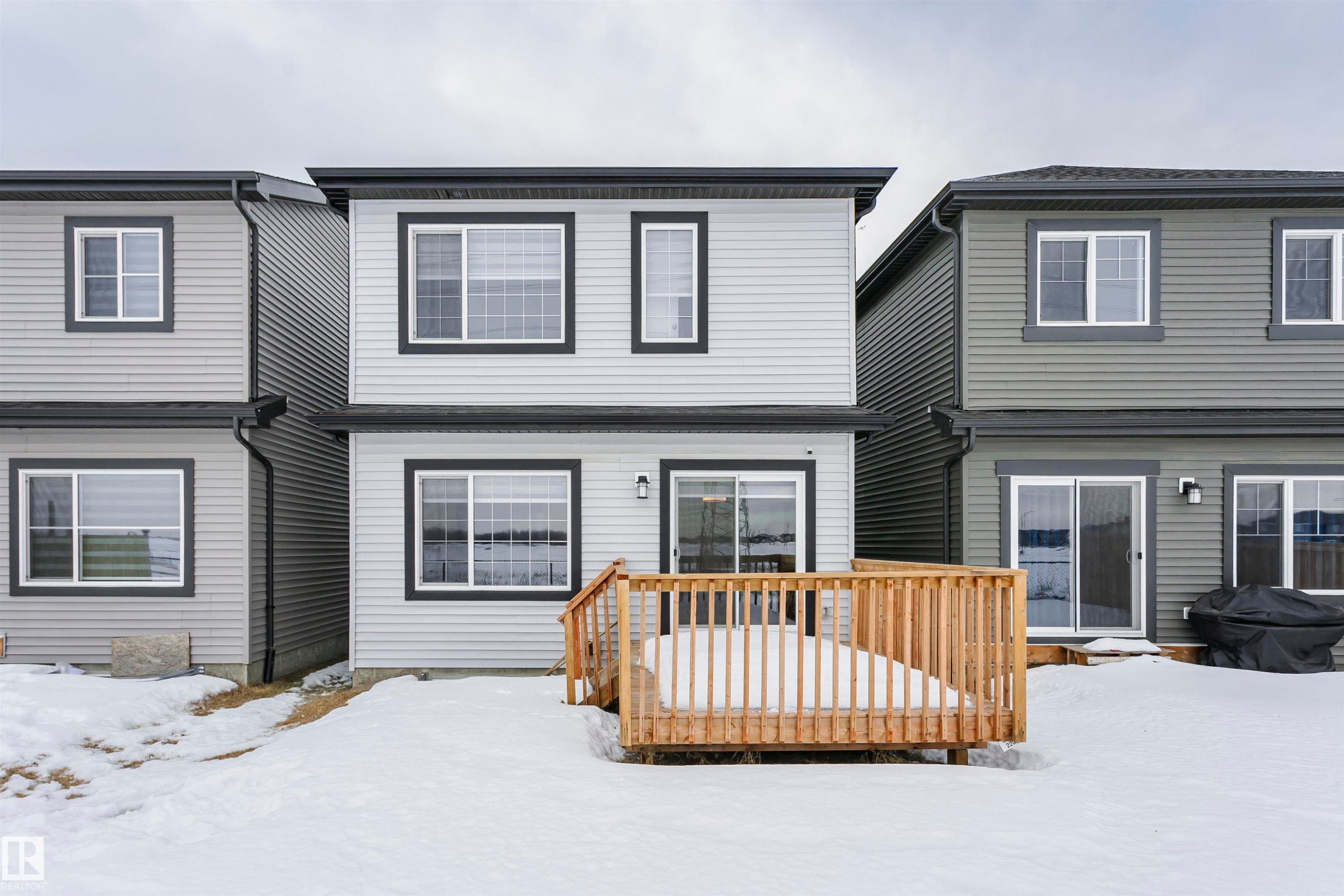 Snow covered property featuring a deck - 9421 Pear Crescent, Edmonton, AB - Outdoor