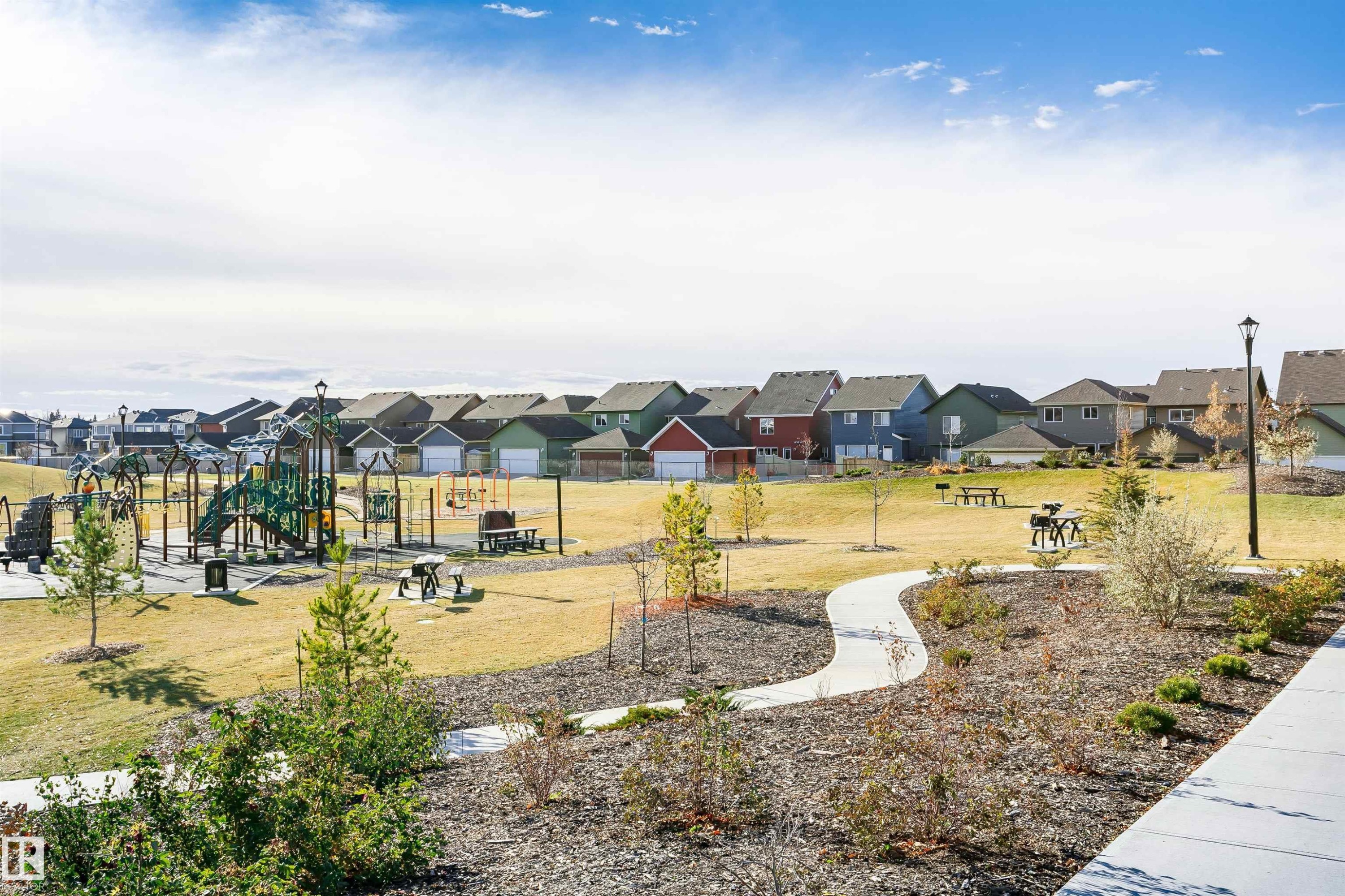 Communal playground with a residential view and a lawn - 9421 Pear Crescent, Edmonton, AB - Outdoor With View
