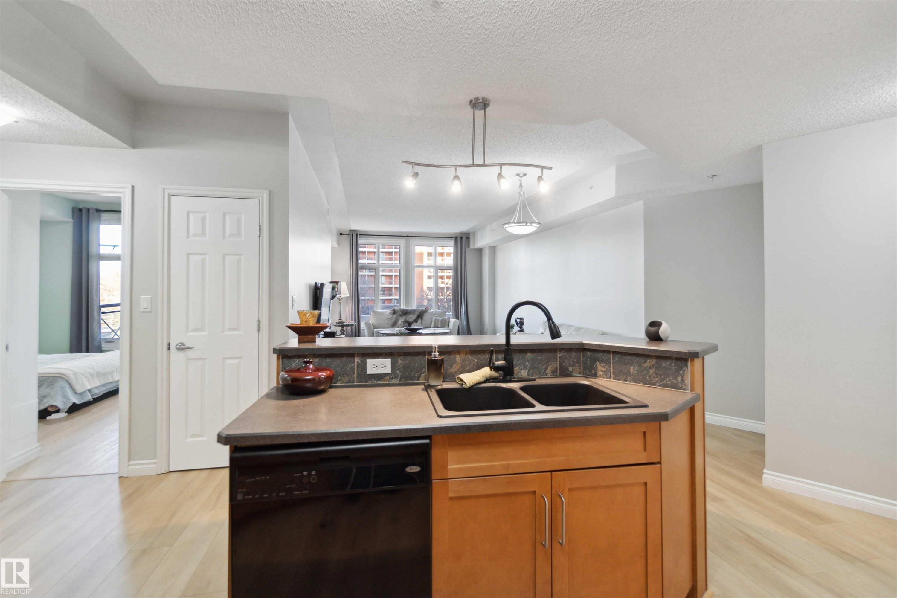 402 9020 Jasper Avenue, Edmonton, AB - Indoor Photo Showing Kitchen With Double Sink
