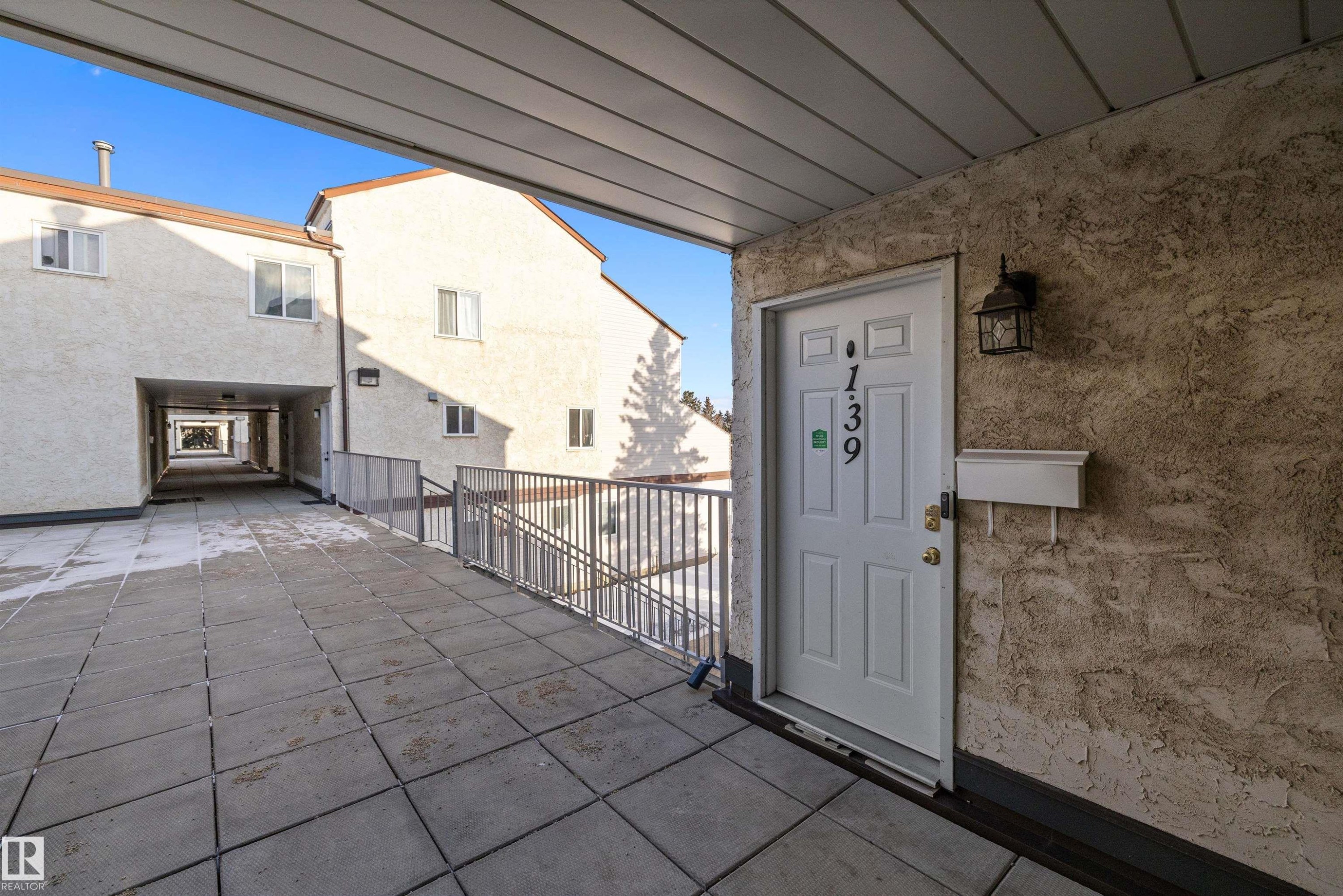 View of exterior entry featuring stucco siding - 139 Lancaster Terrace, Edmonton, AB - Outdoor With Exterior