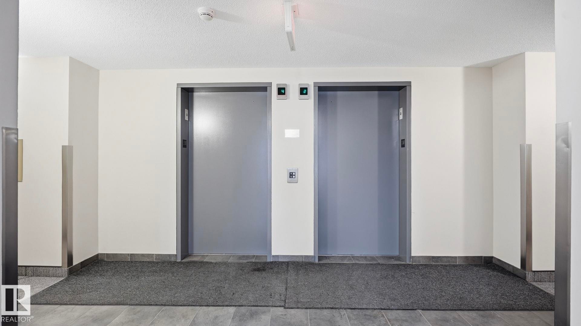 View of exterior entry featuring elevator - 401 636 Mcallister Loop, Edmonton, AB - Indoor Photo Showing Other Room