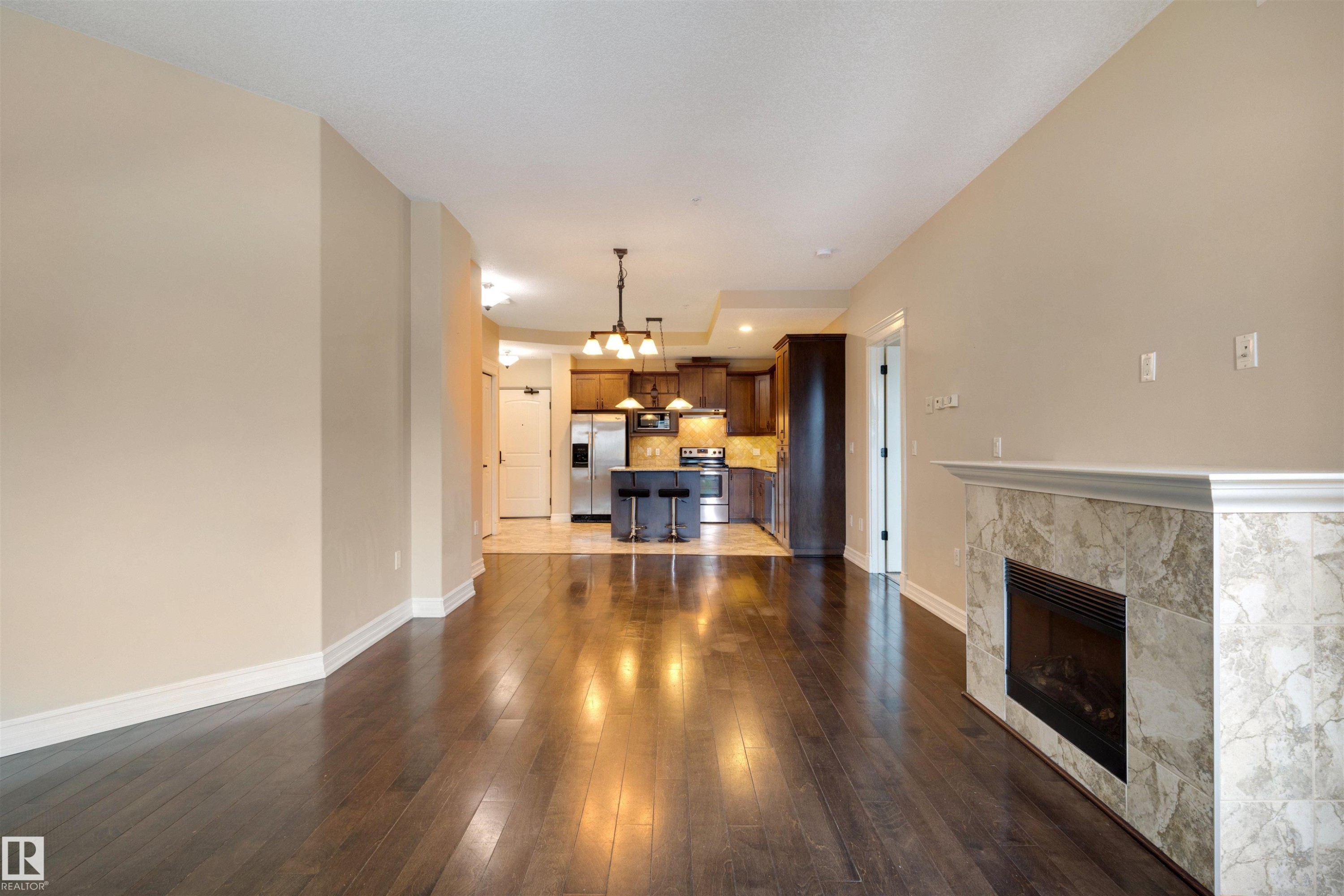 906 10142 111 Street, Edmonton, AB - Indoor Photo Showing Living Room With Fireplace
