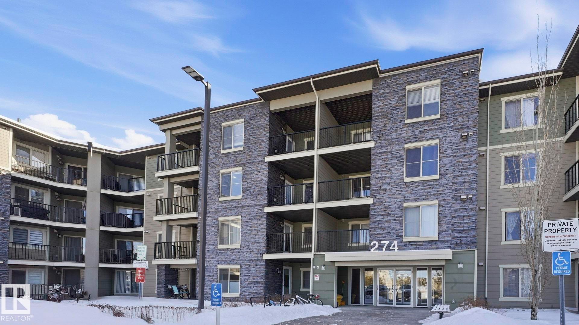 Snow covered property featuring a view of apartment building / complex - 319 274 Mcconachie Drive, Edmonton, AB - Outdoor With Balcony With Facade