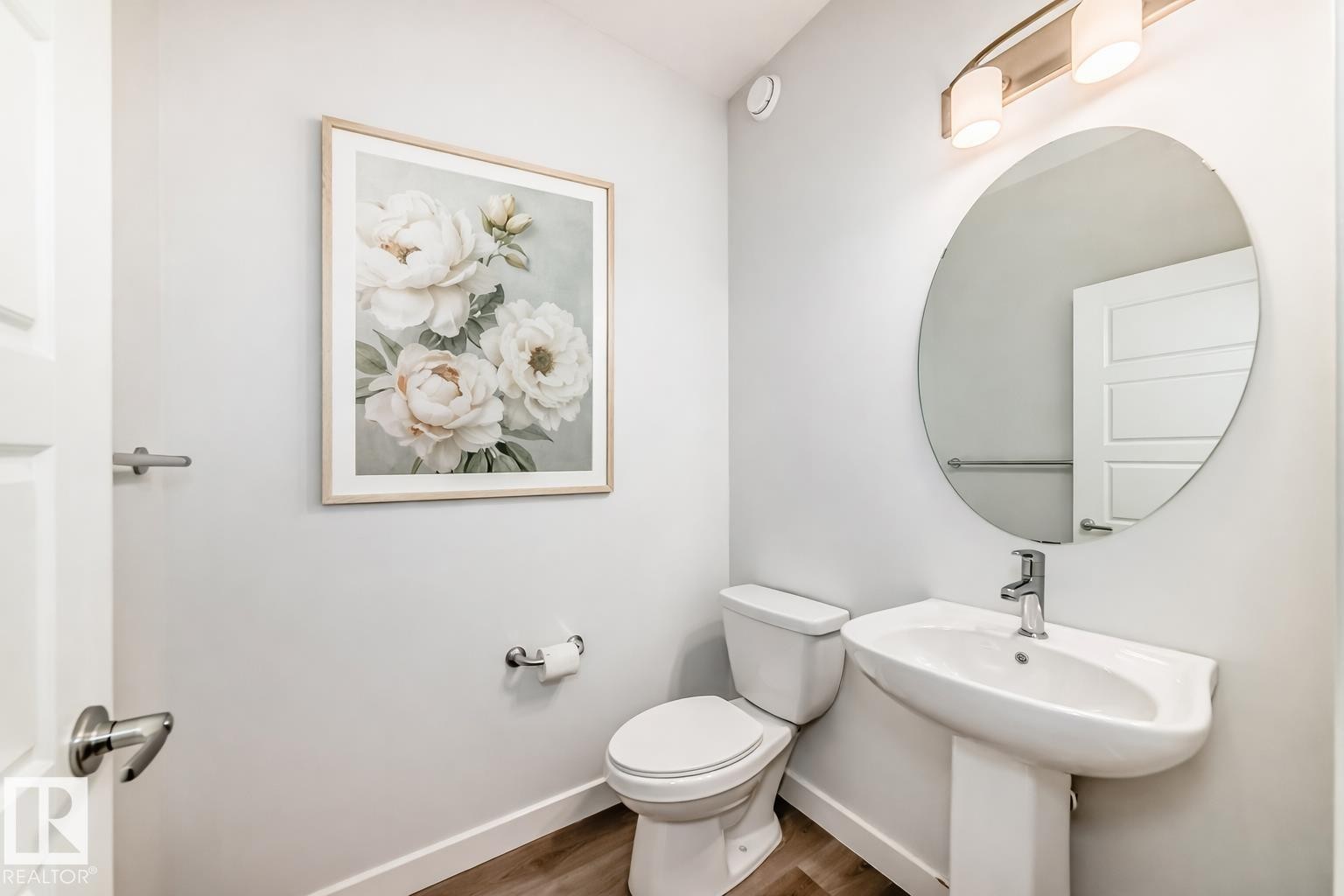 Half bath with toilet and wood finished floors - 2282 Chokecherry Close, Edmonton, AB - Indoor Photo Showing Bathroom