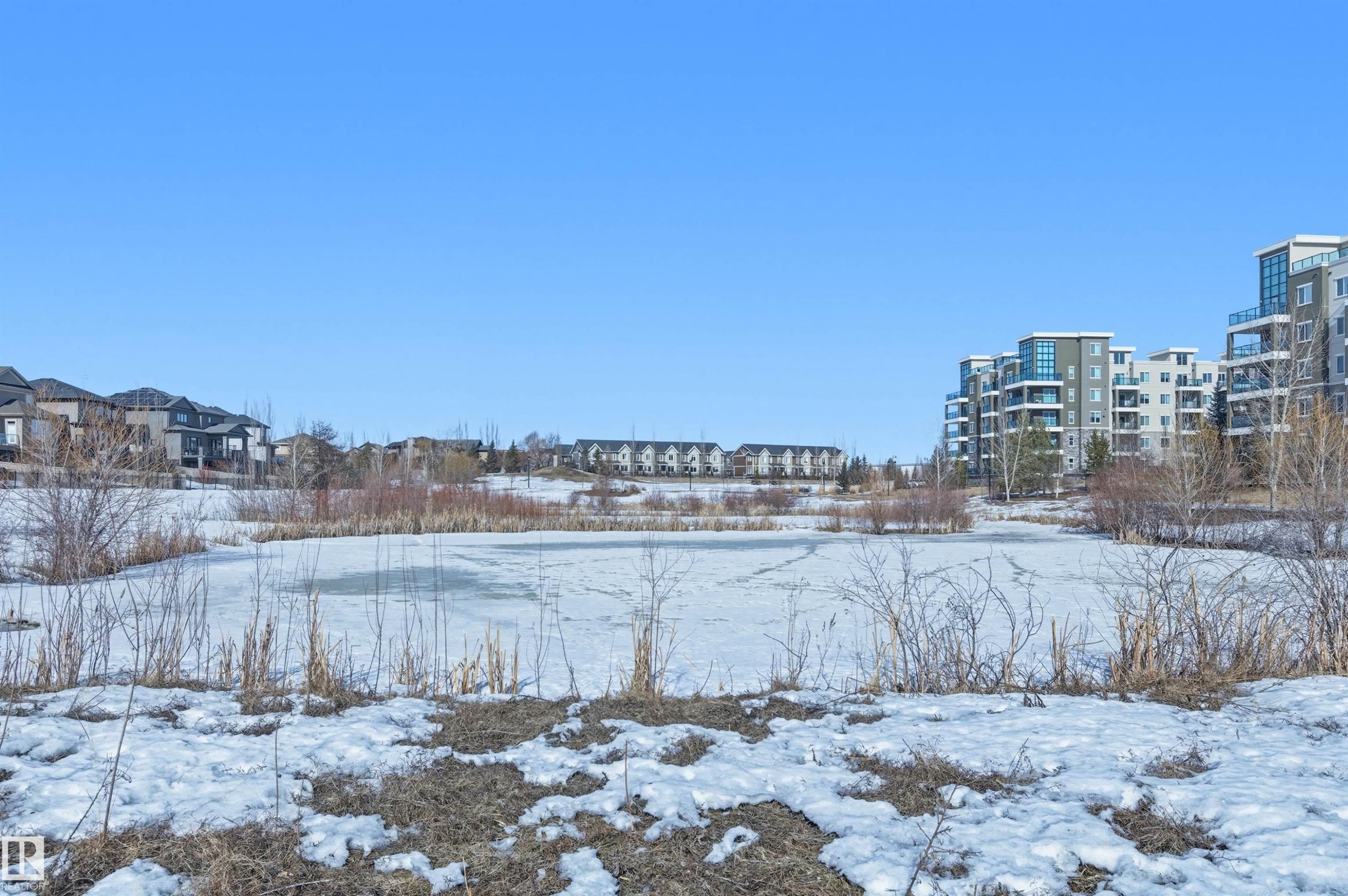 View of snowy yard - 106 1238 Windermere Way, Edmonton, AB - Outdoor