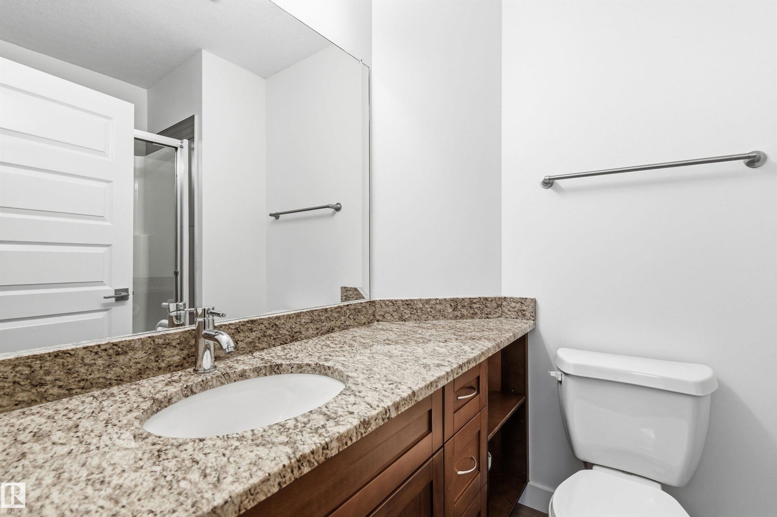 Full bathroom with vanity and a stall shower - 106 1238 Windermere Way, Edmonton, AB - Indoor Photo Showing Bathroom