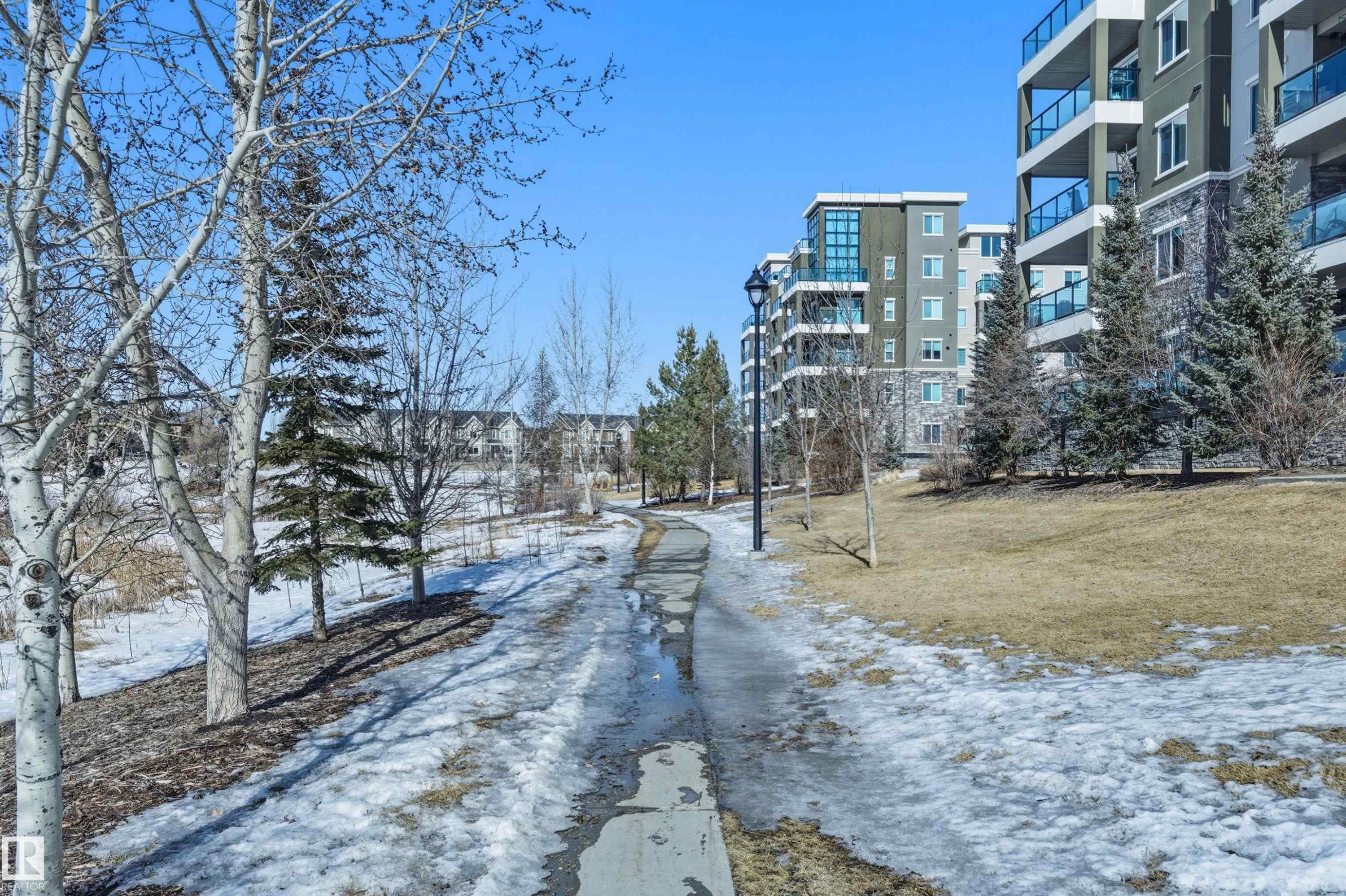 View of street featuring street lighting - 106 1238 Windermere Way, Edmonton, AB - Outdoor With Balcony