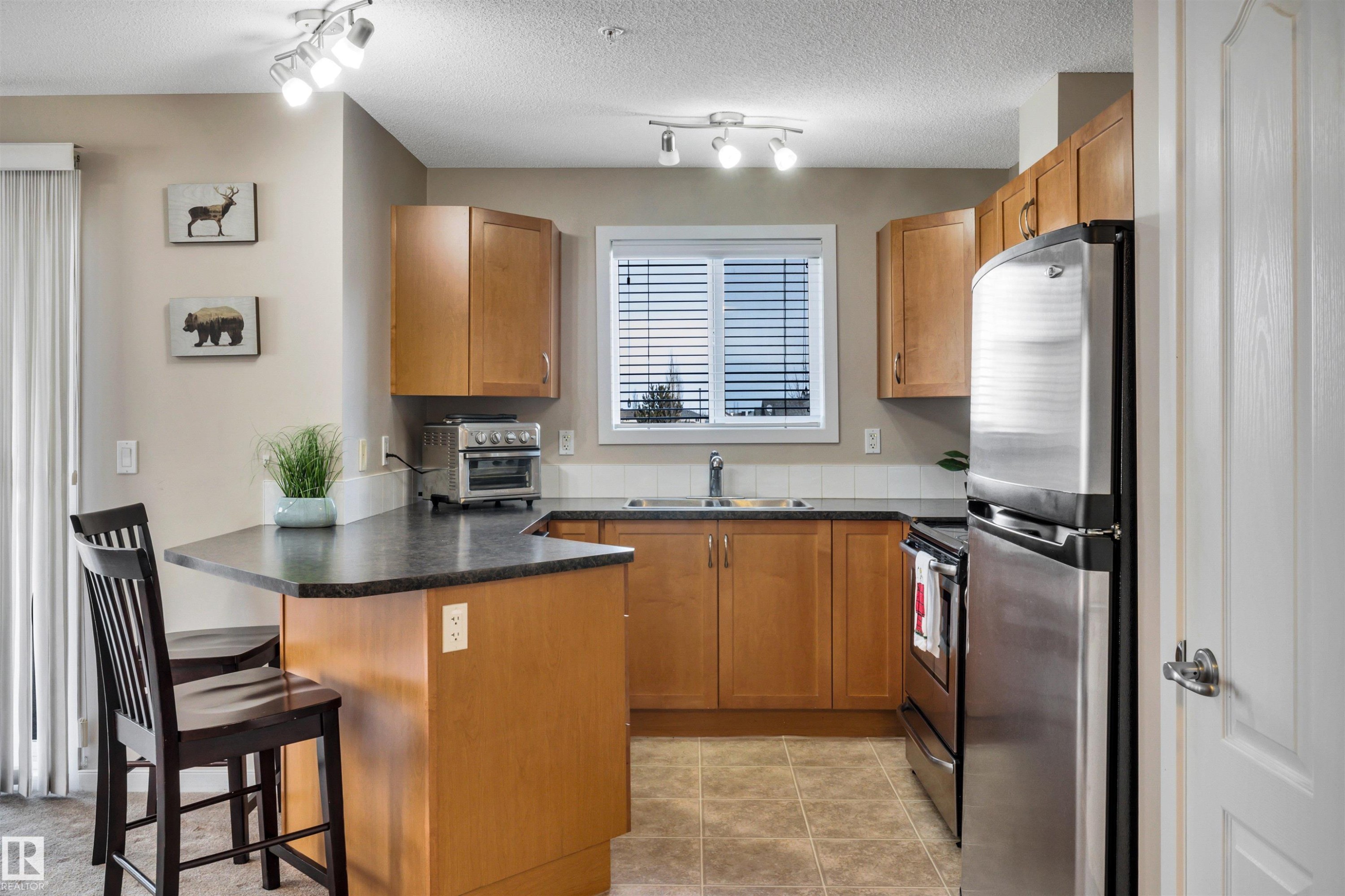 215 392 Silver Berry Road, Edmonton, AB - Indoor Photo Showing Kitchen With Stainless Steel Kitchen With Double Sink