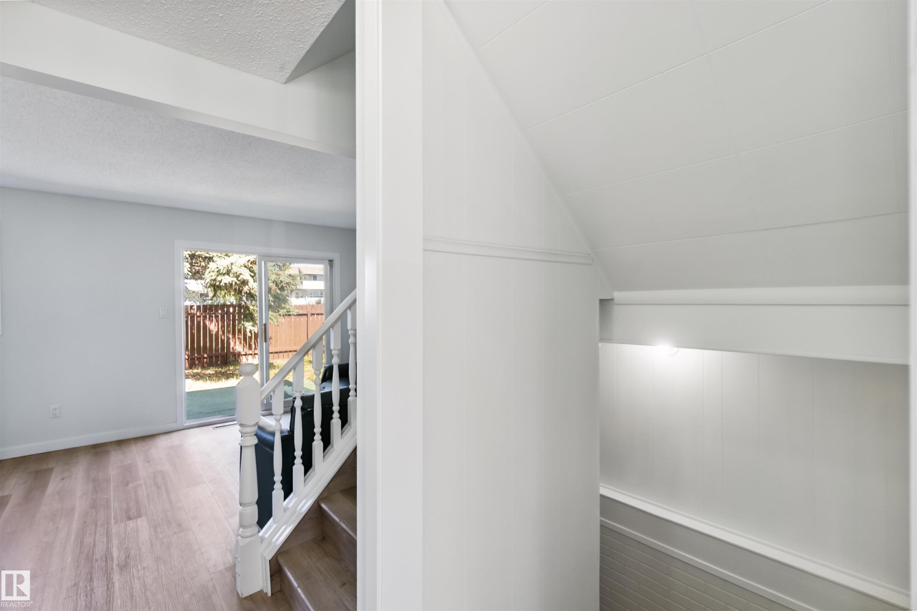 Stairway featuring wood finished floors and baseboards - 1096 Millbourne Road E, Edmonton, AB - Indoor Photo Showing Other Room