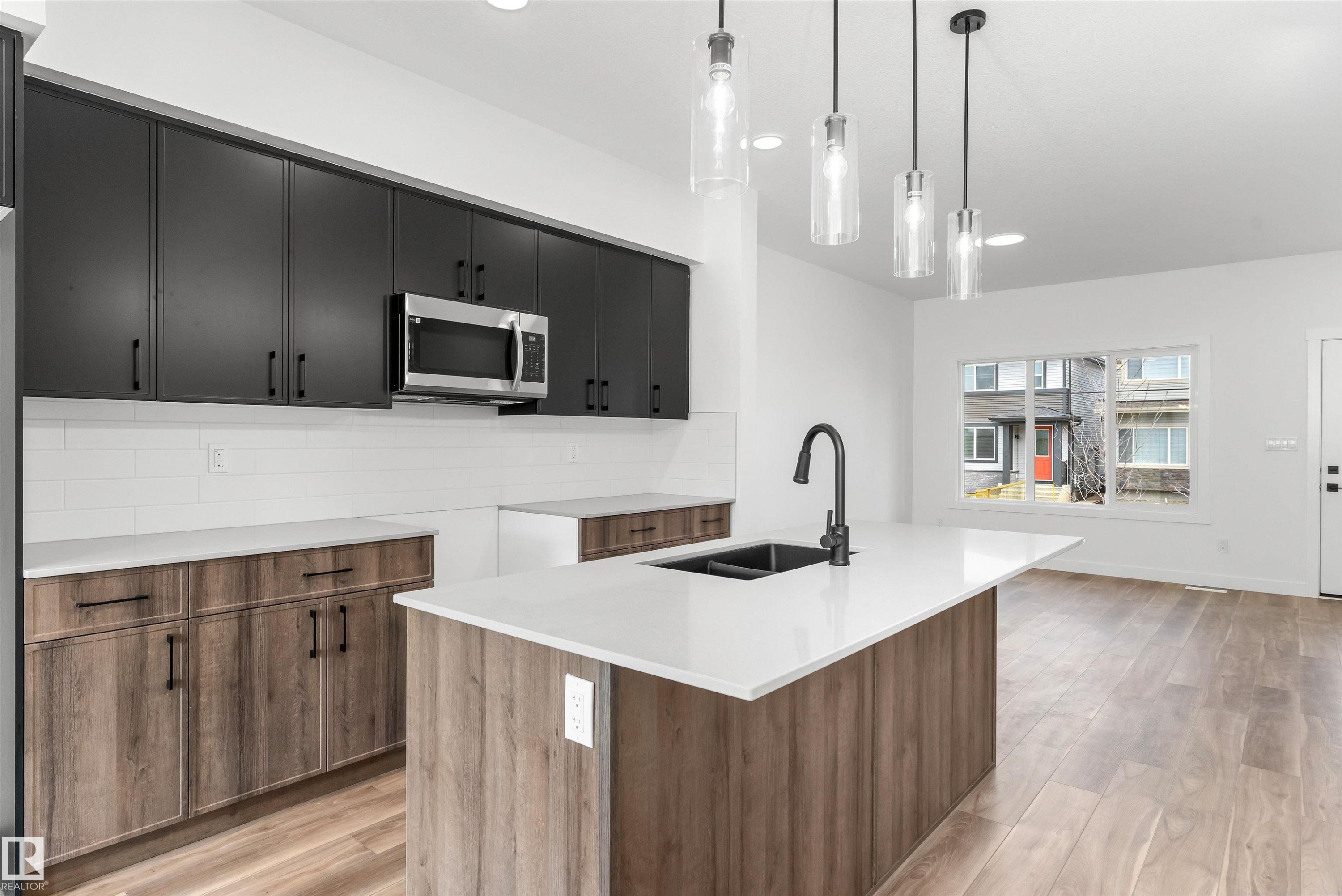 6261 175A Avenue, Edmonton, AB - Indoor Photo Showing Kitchen With Double Sink
