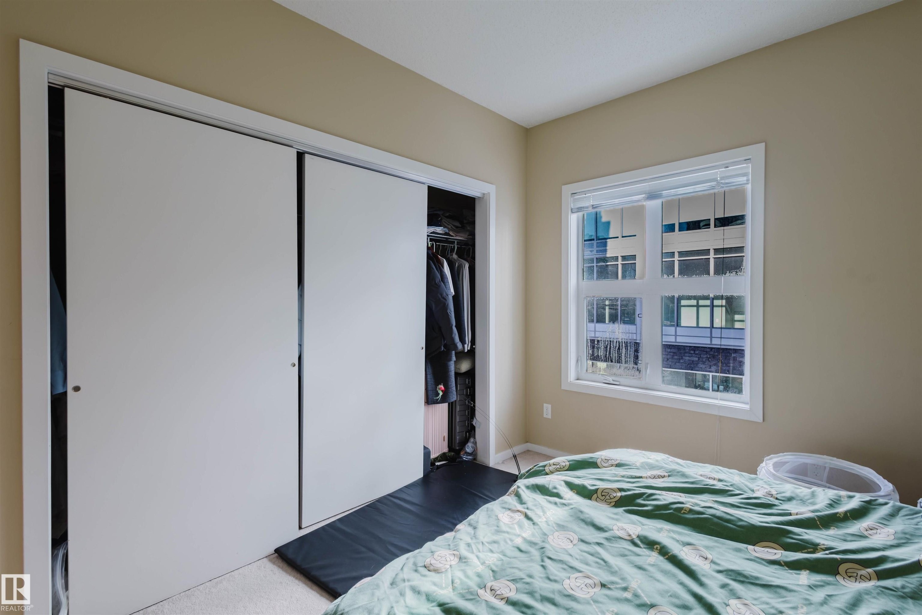 Bedroom with a closet - 207 9910 111 Street, Edmonton, AB - Indoor Photo Showing Bedroom