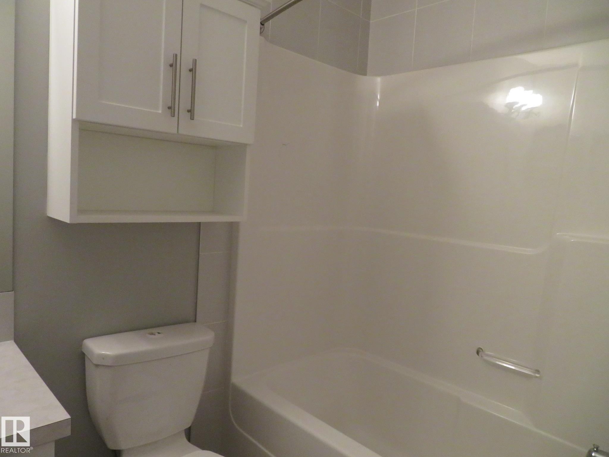 Bathroom featuring shower / tub combination and vanity - 415 2590 Anderson Way, Edmonton, AB - Indoor Photo Showing Bathroom