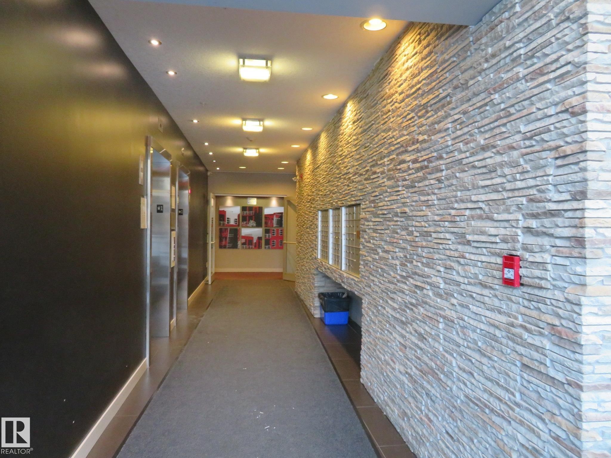 Hallway featuring recessed lighting and elevator - 415 2590 Anderson Way, Edmonton, AB - Indoor Photo Showing Other Room