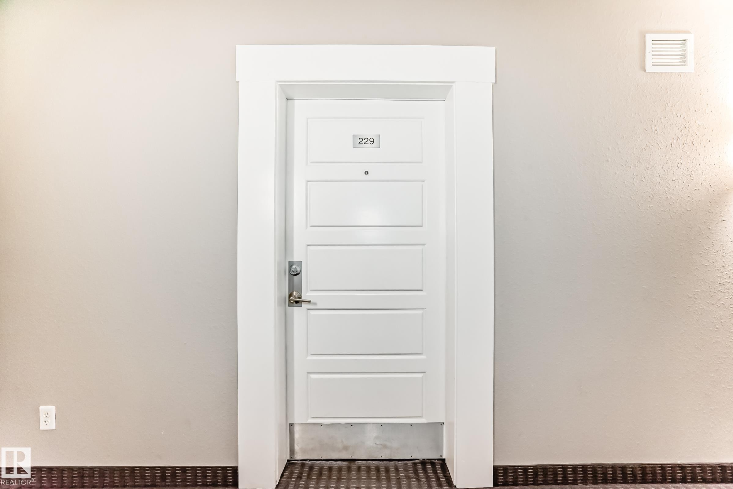 View of exterior entry - 229 6076 Schonsee Way, Edmonton, AB - Indoor Photo Showing Other Room