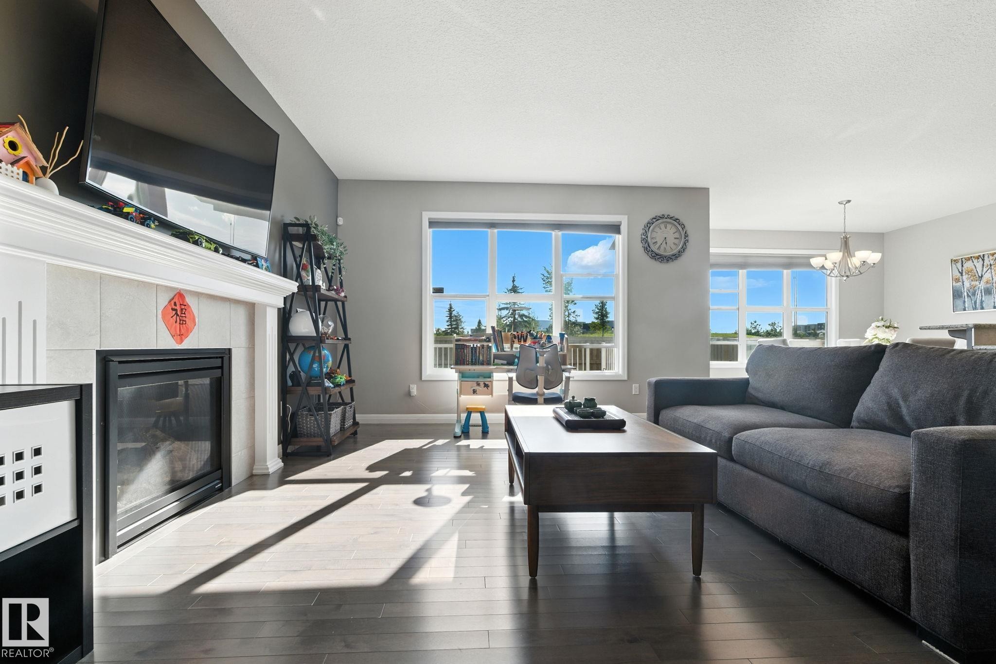 Edmonton, AB - Indoor Photo Showing Living Room With Fireplace
