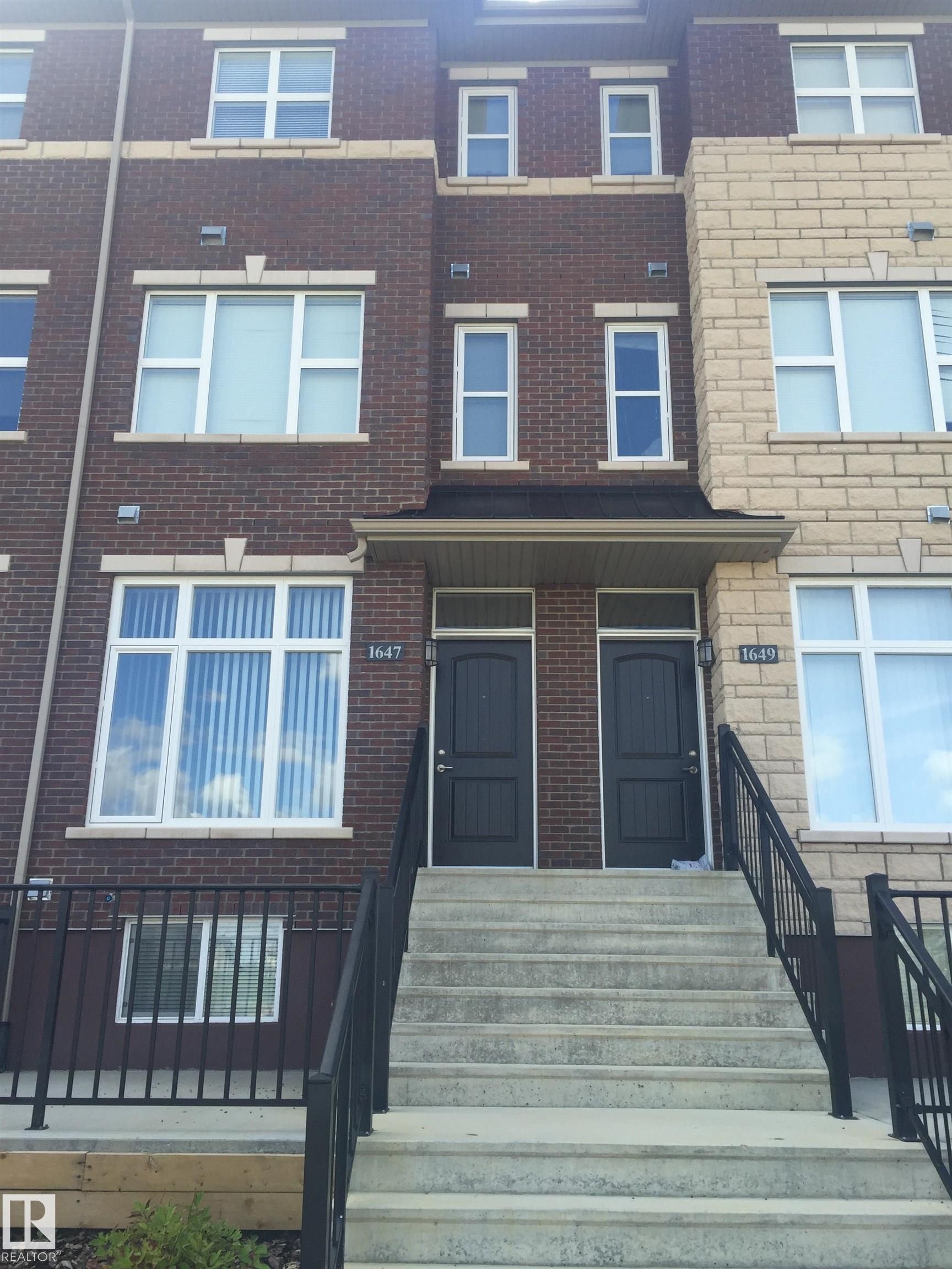 View of front facade with brick siding - 1649 Cunningham Way, Edmonton, AB - Outdoor